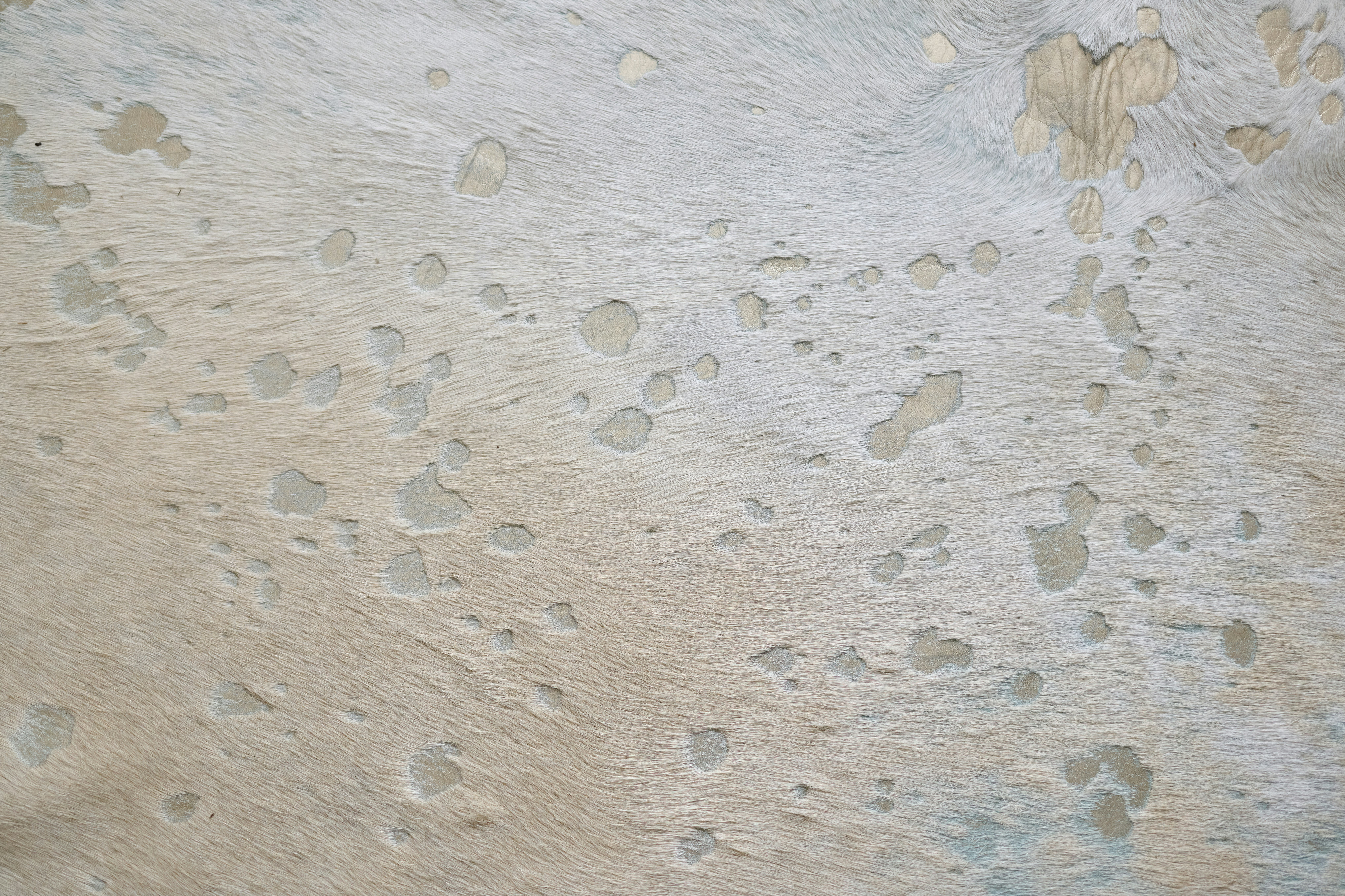 A close up of a wall with a lot of holes in it