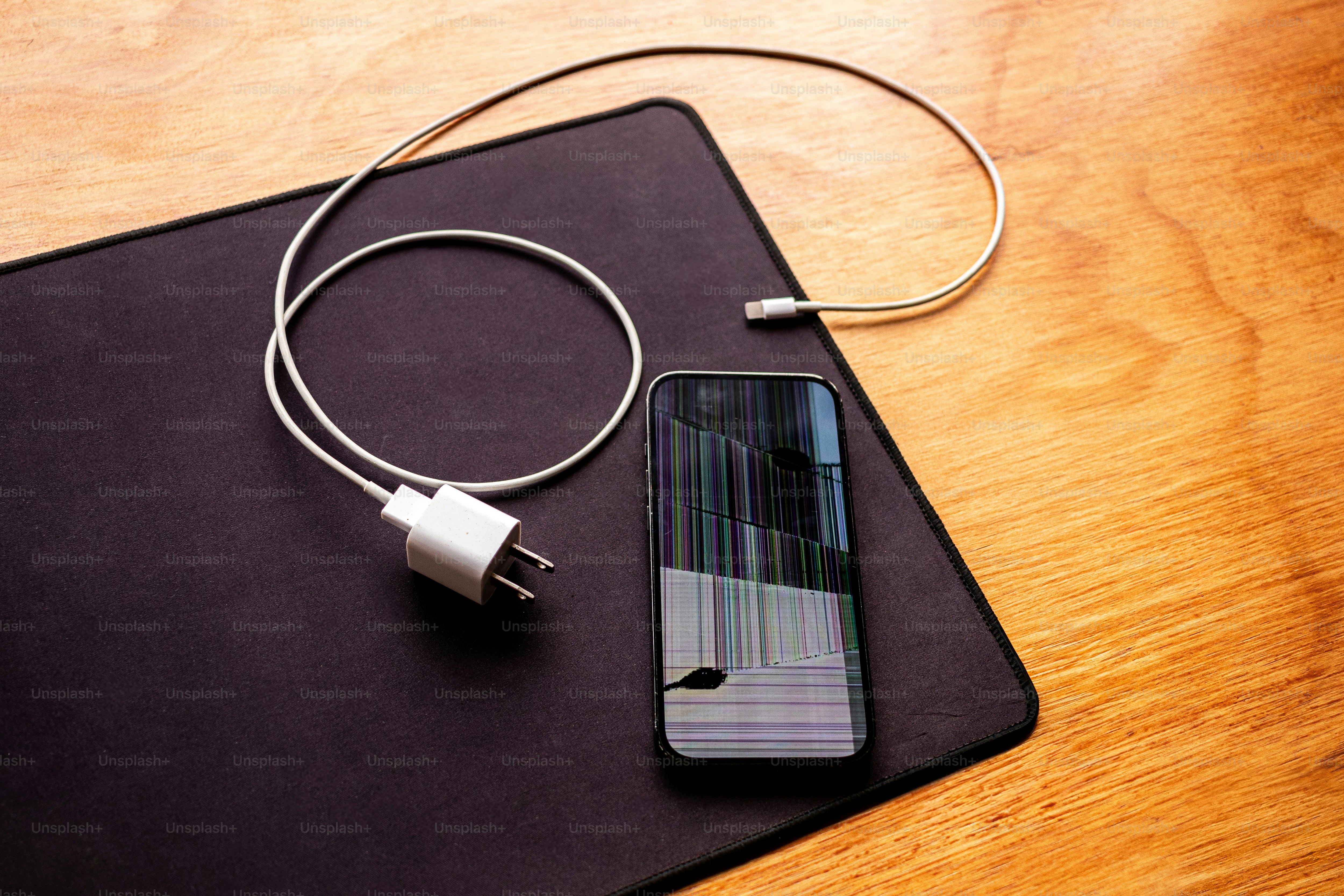 A cell phone is plugged into a charger