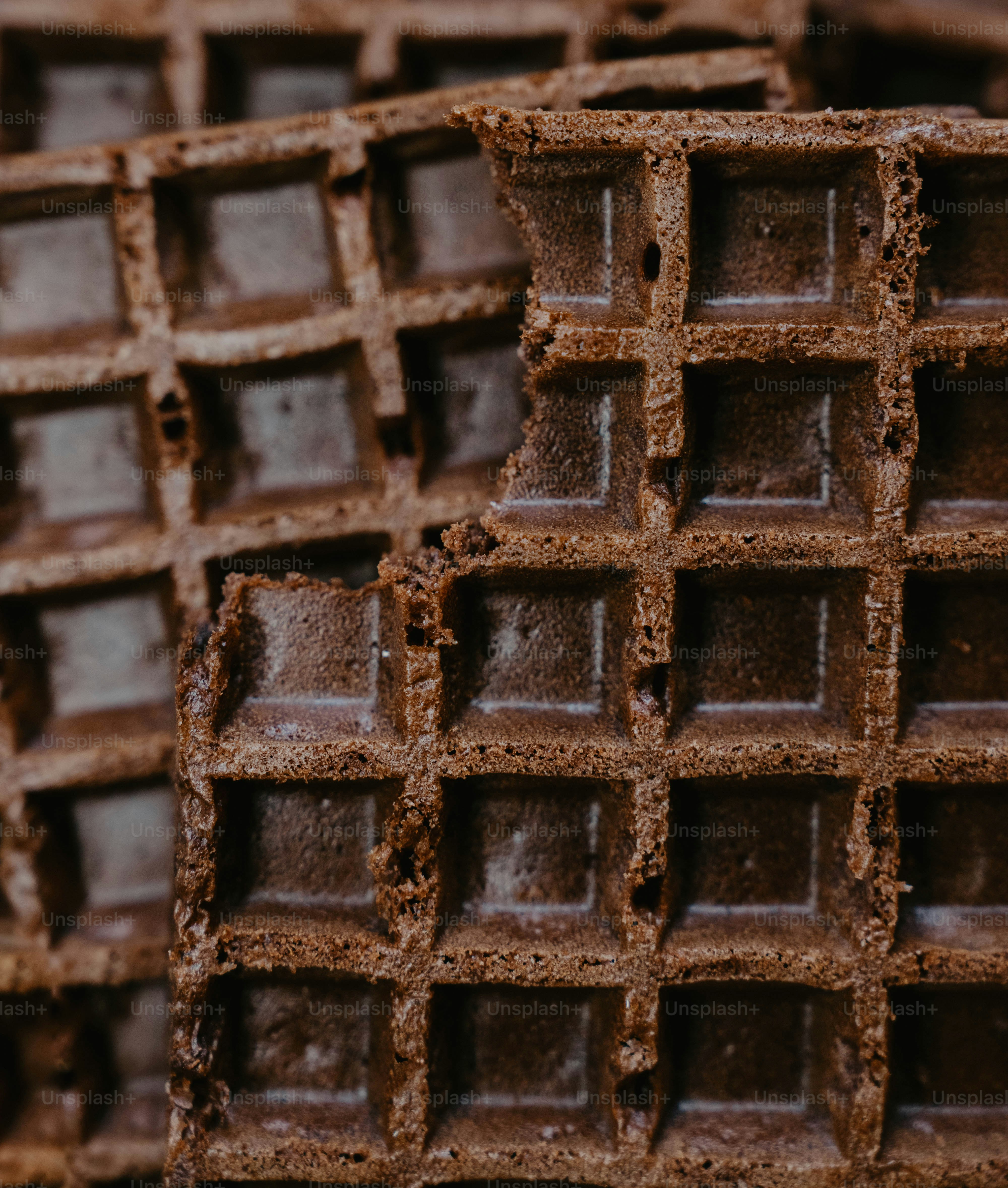 A stack of chocolate bars stacked on top of each other photo – Close up ...