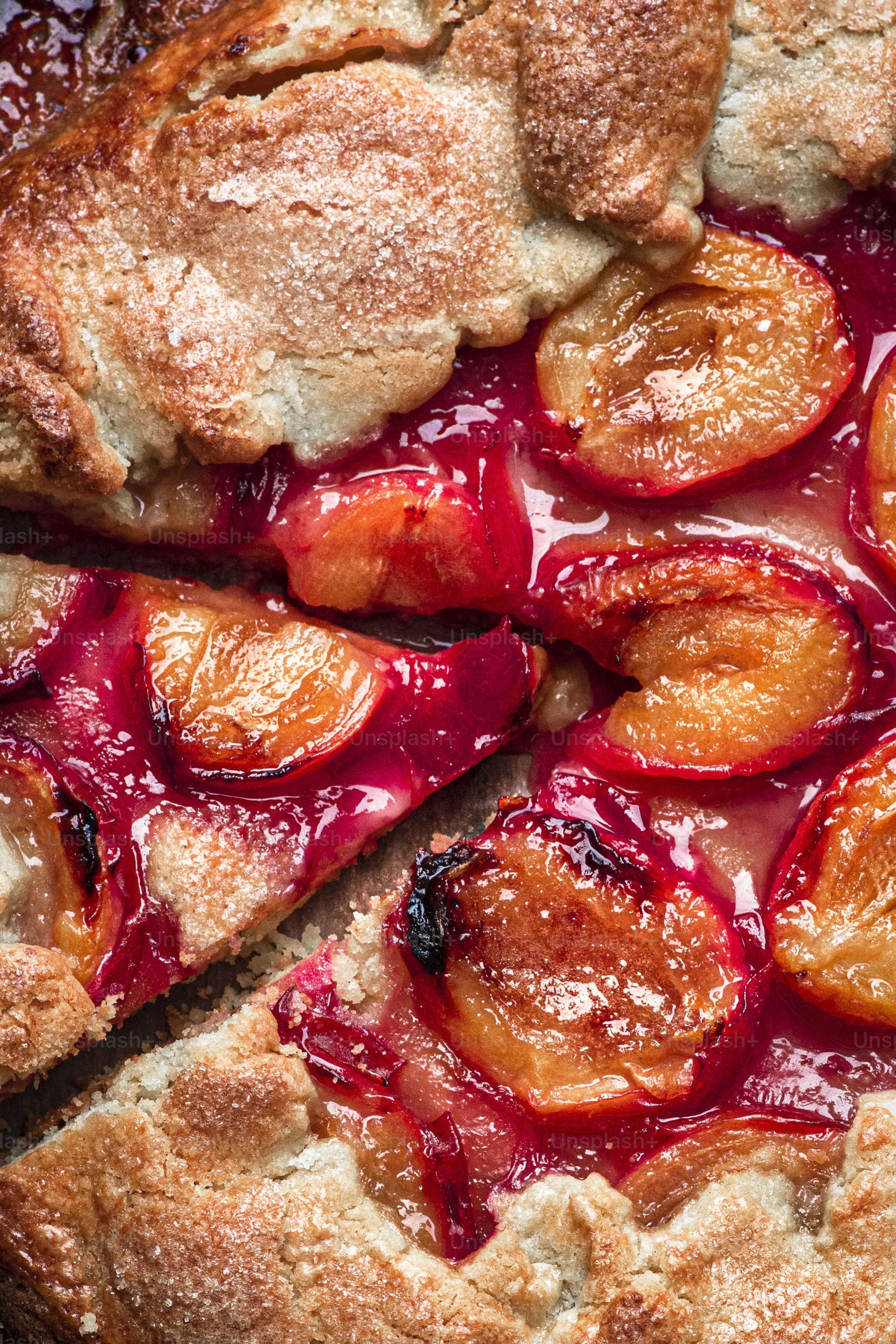 A close up of a pie with fruit on it