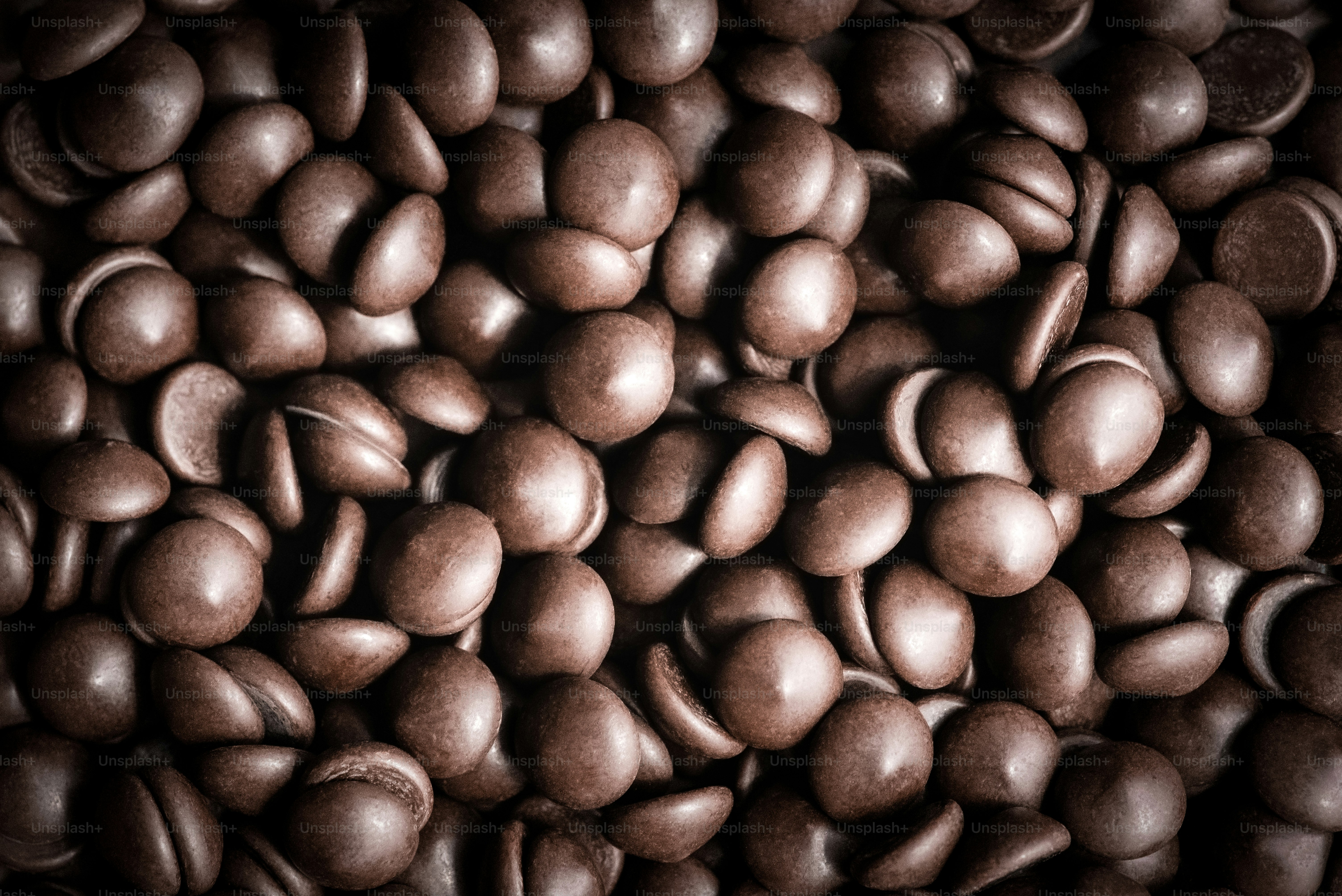 A pile of chocolate beans sitting on top of each other