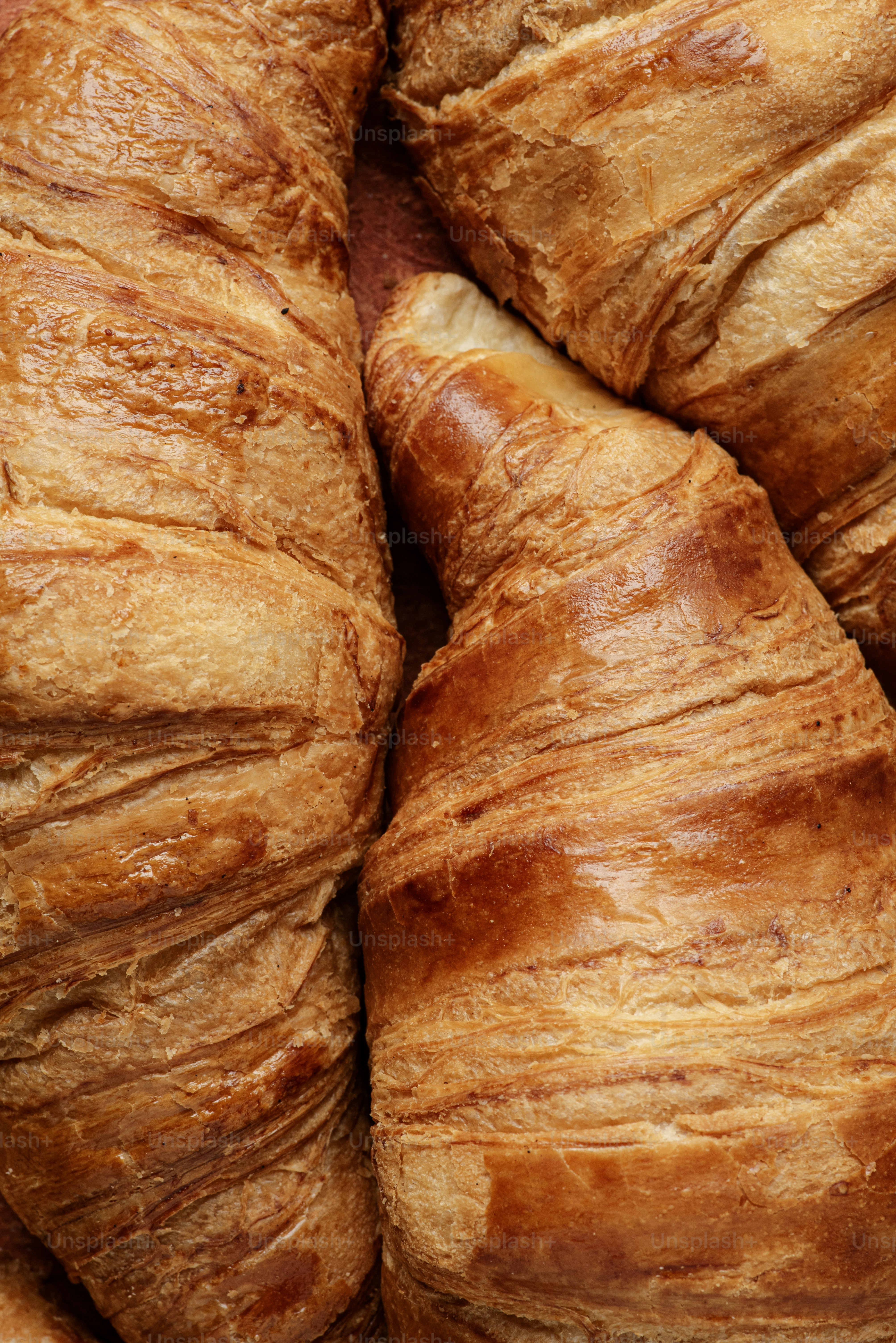 A pile of croissants sitting next to each other