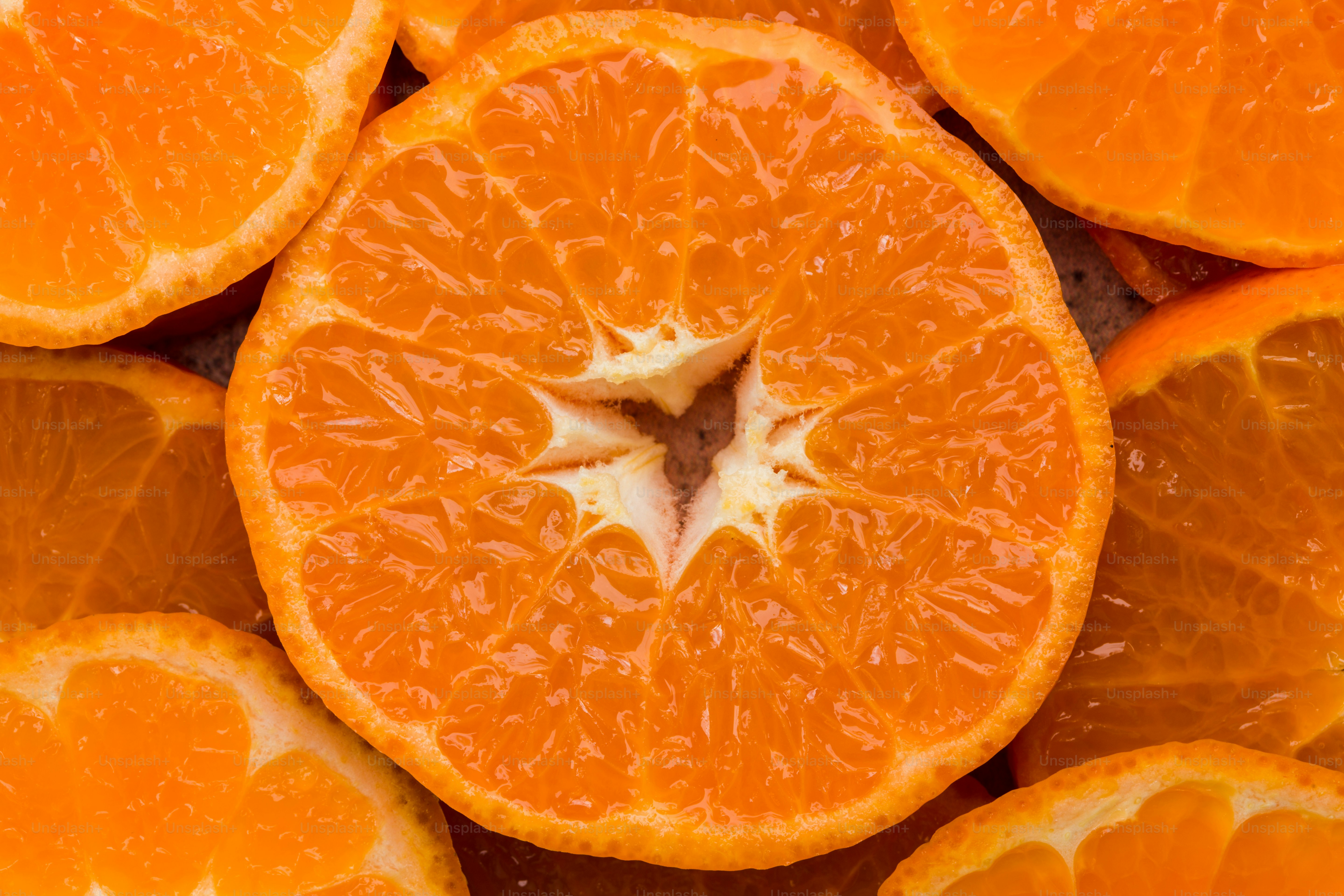 A group of oranges that are cut in half