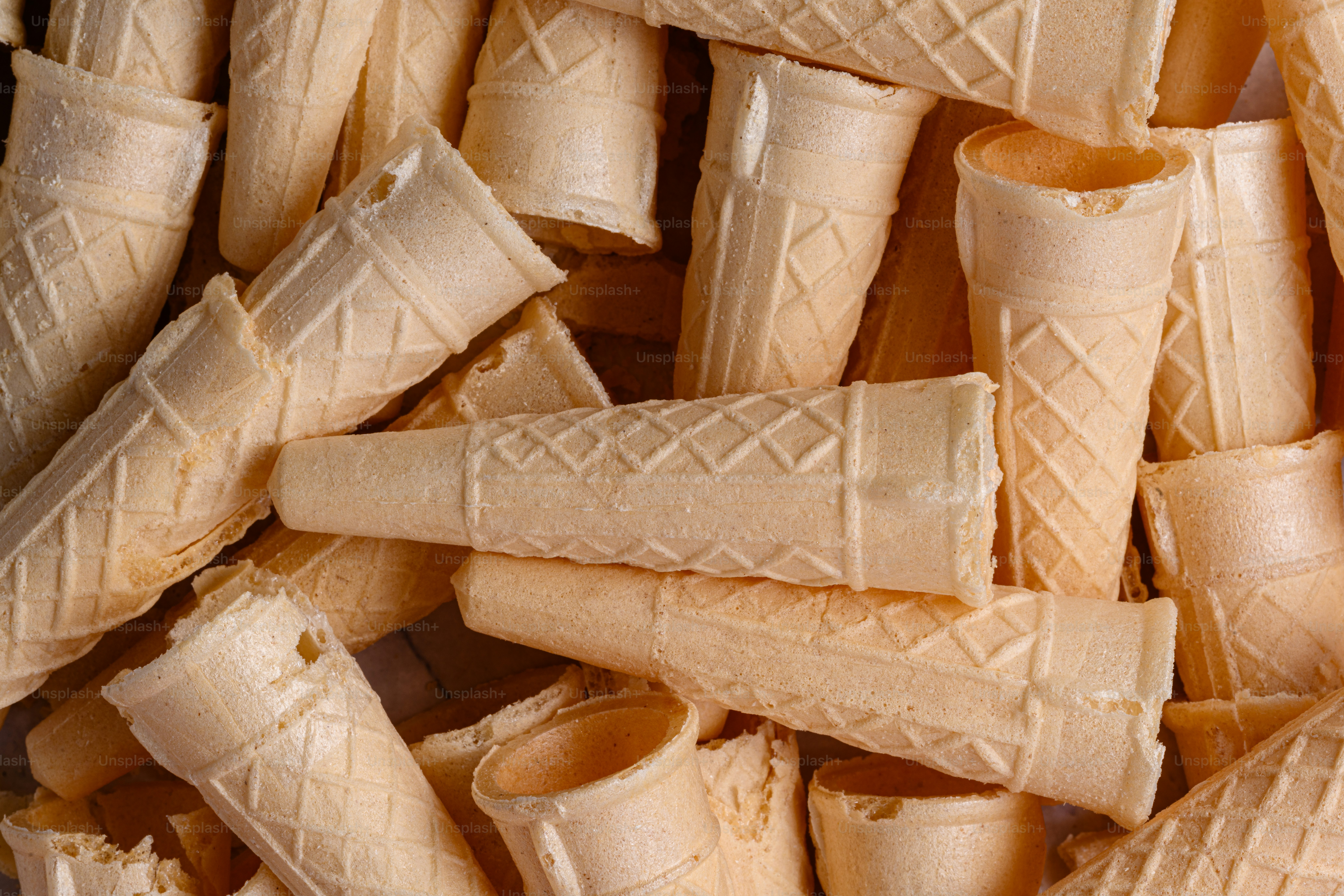 A pile of ice cream cones sitting next to each other