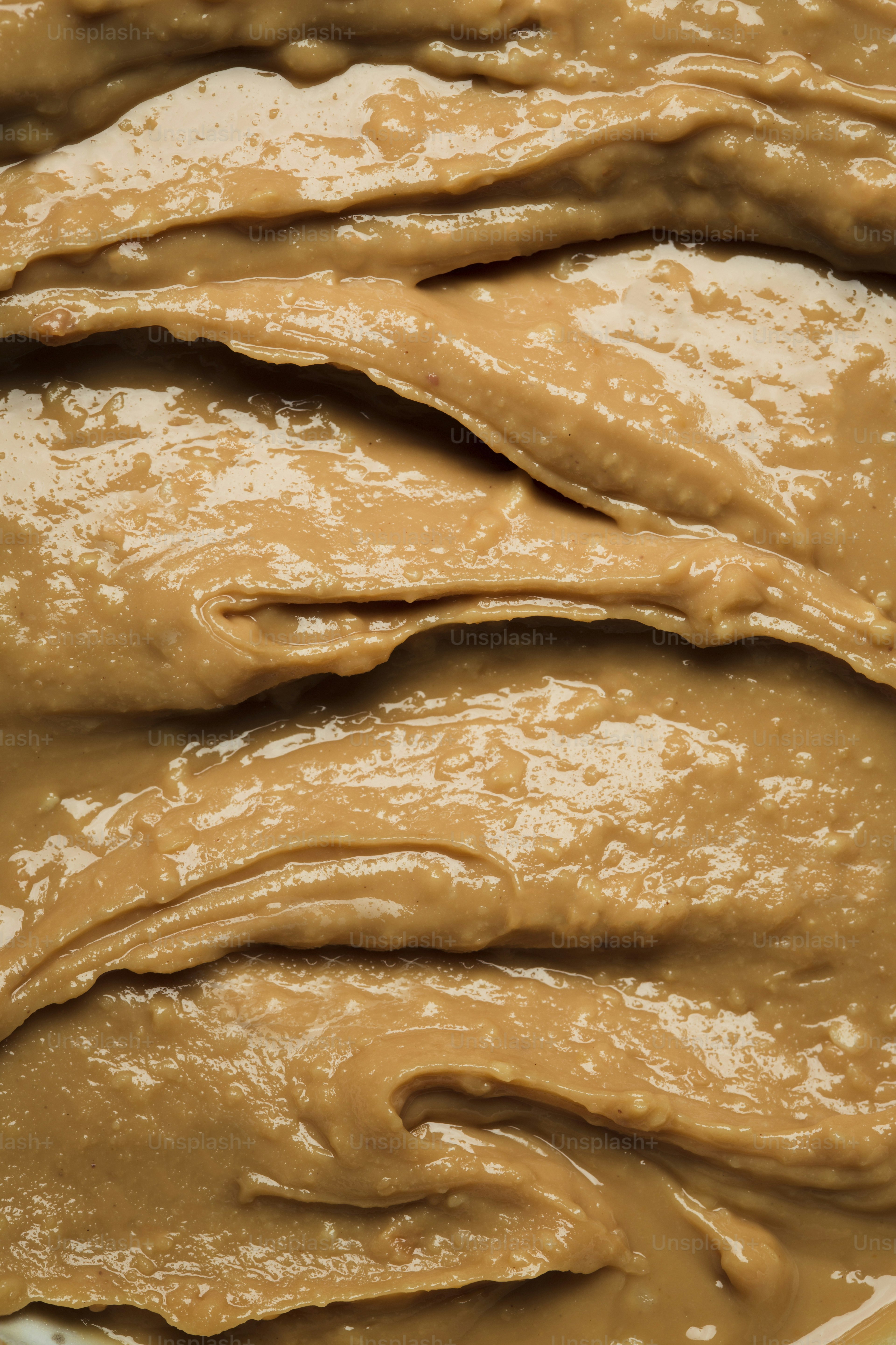 A close up of a bowl of peanut butter