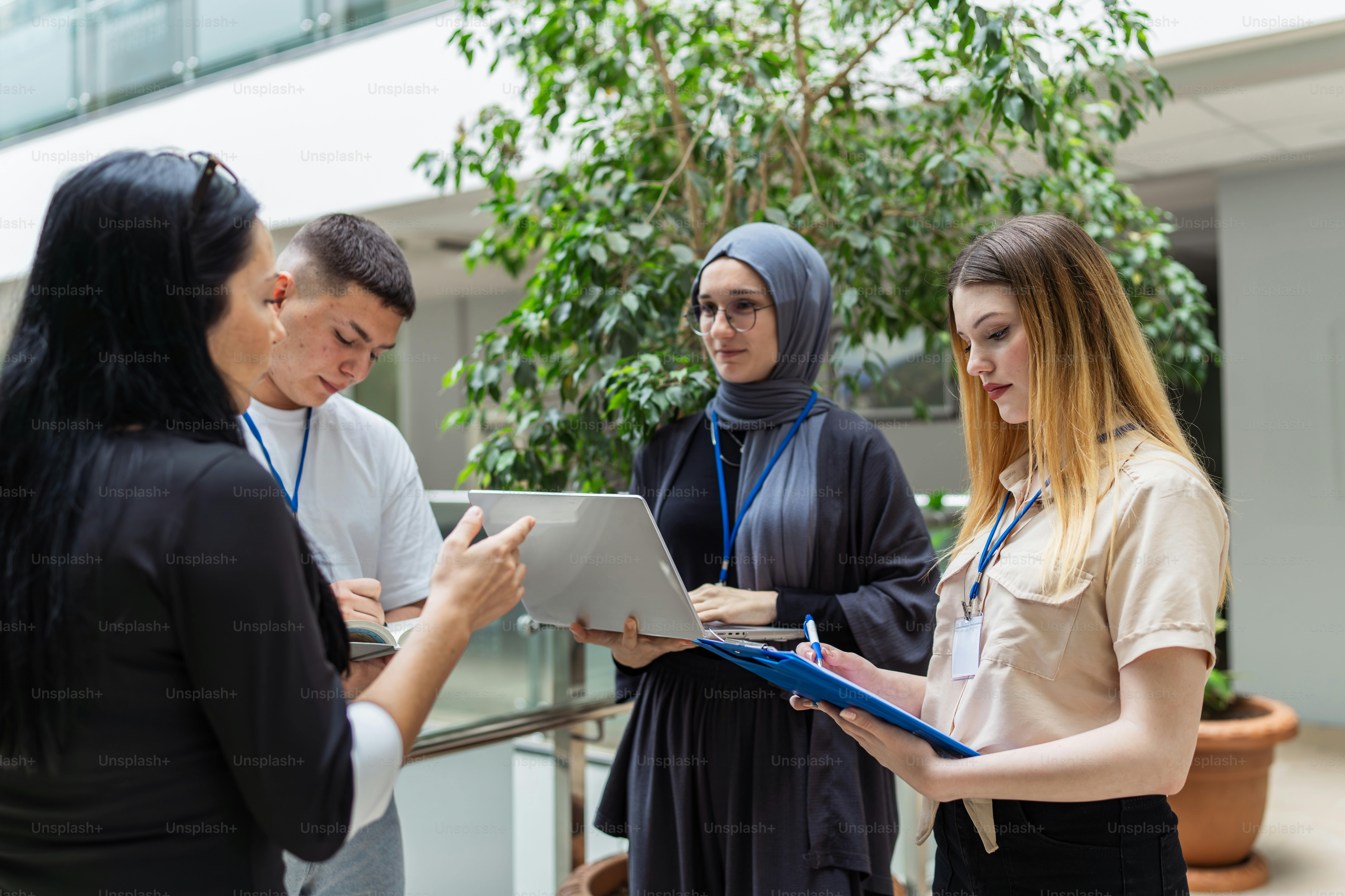 A group of people standing around each other