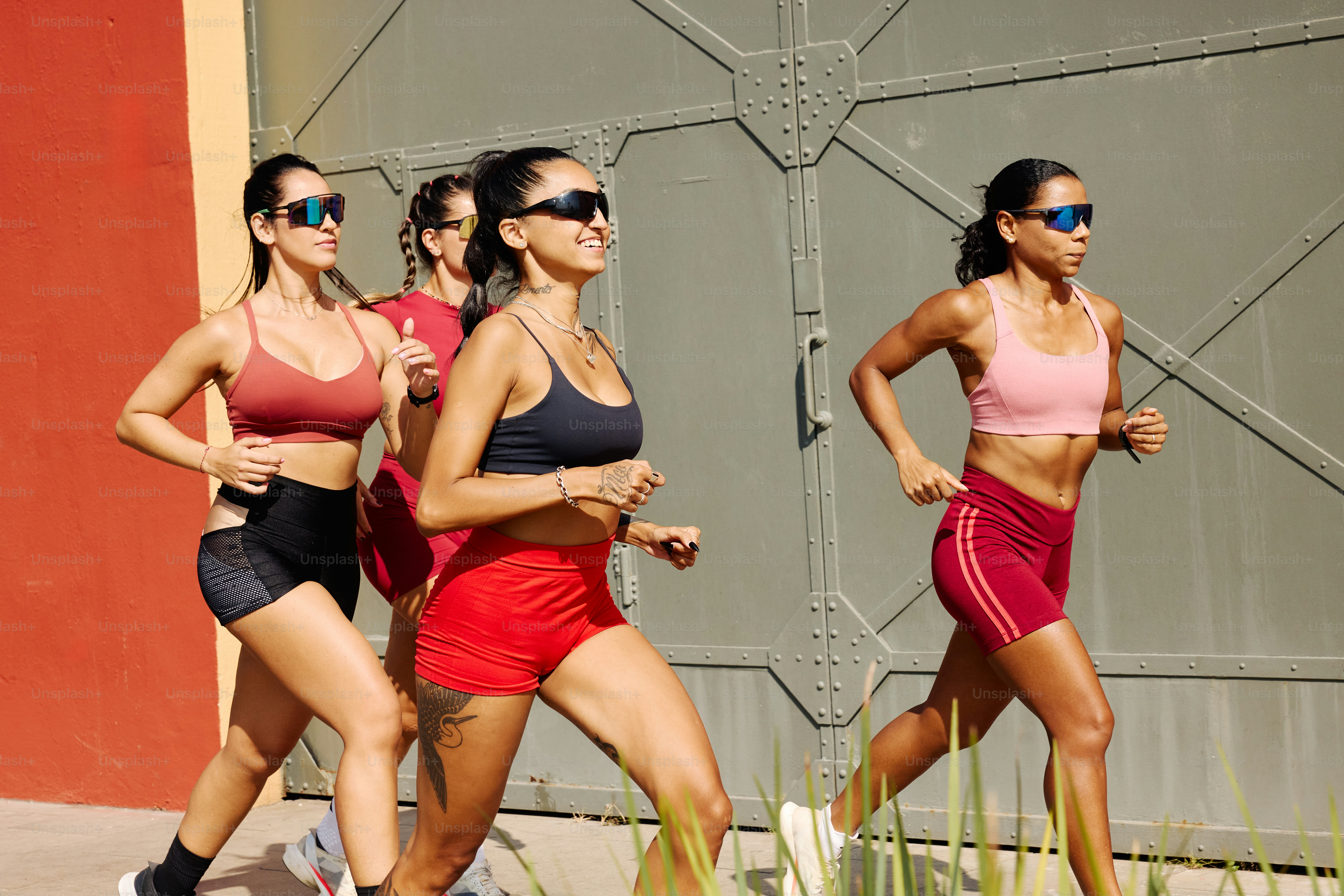 Runner training outdoors with running sunglasses during sunny marathon preparation