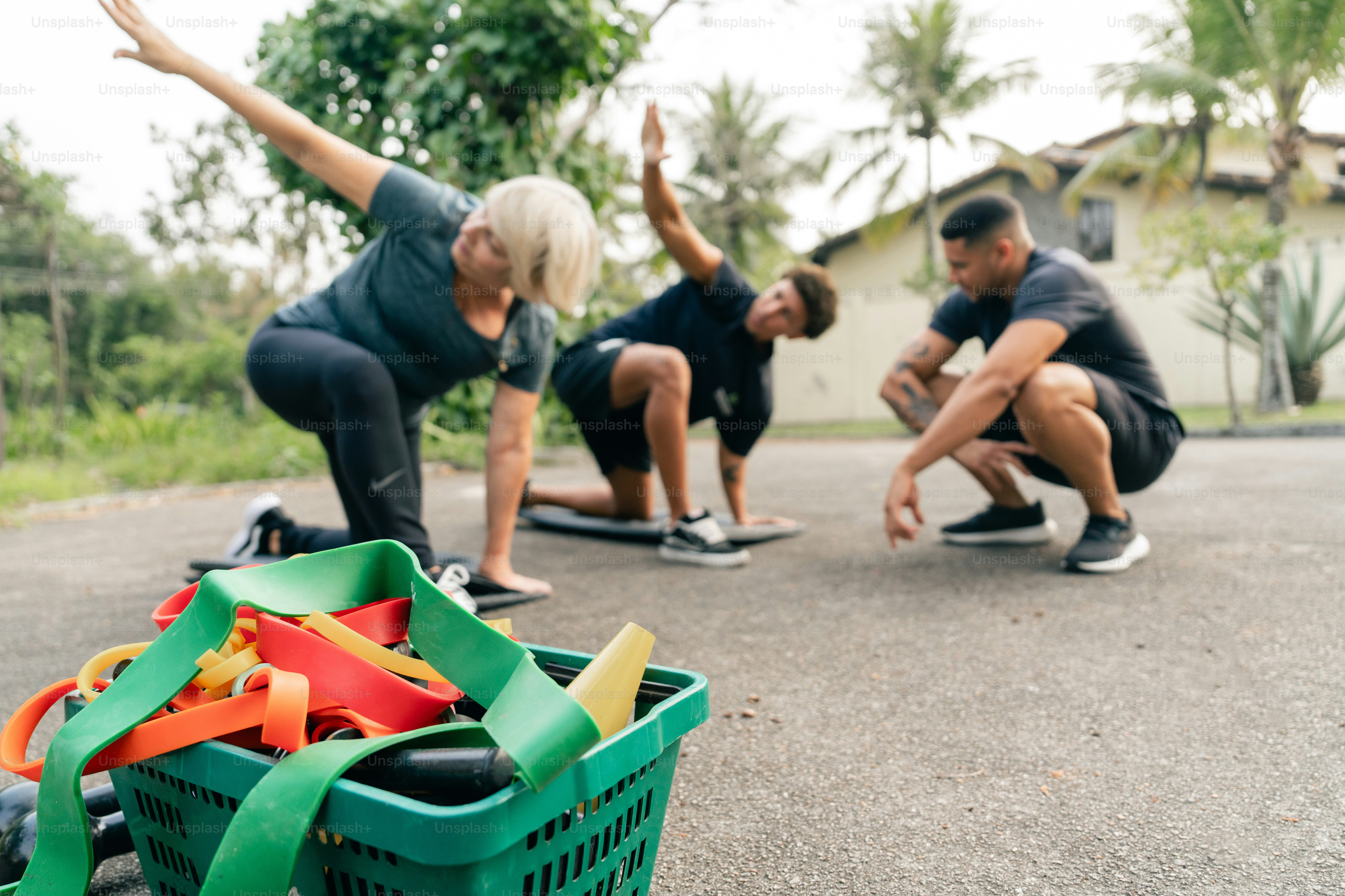 A group of people doing a stretching exercise