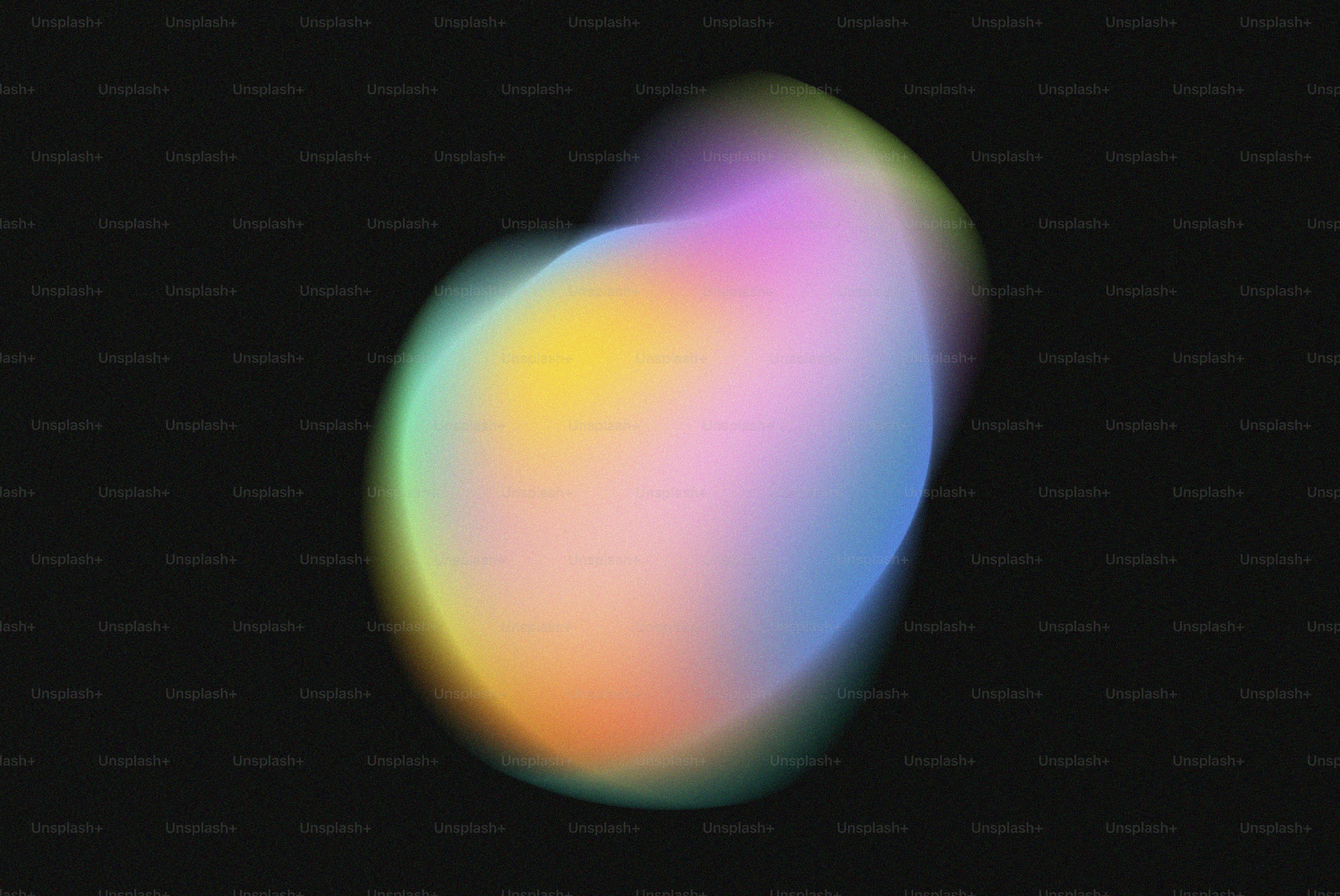 Uma imagem borrada de um objeto colorido em um fundo preto