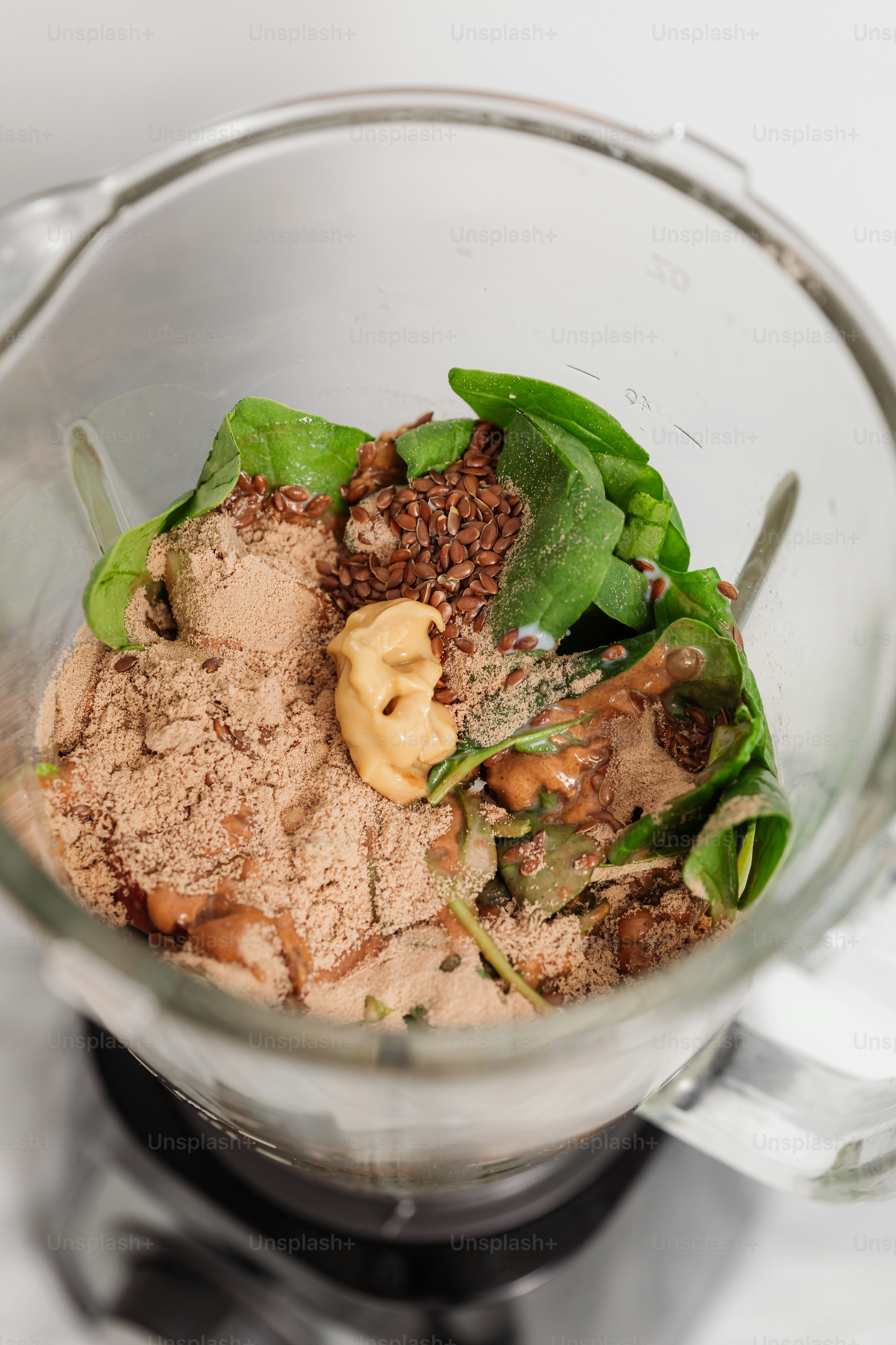 A blender filled with a mixture of ingredients photo – Healthy food ...