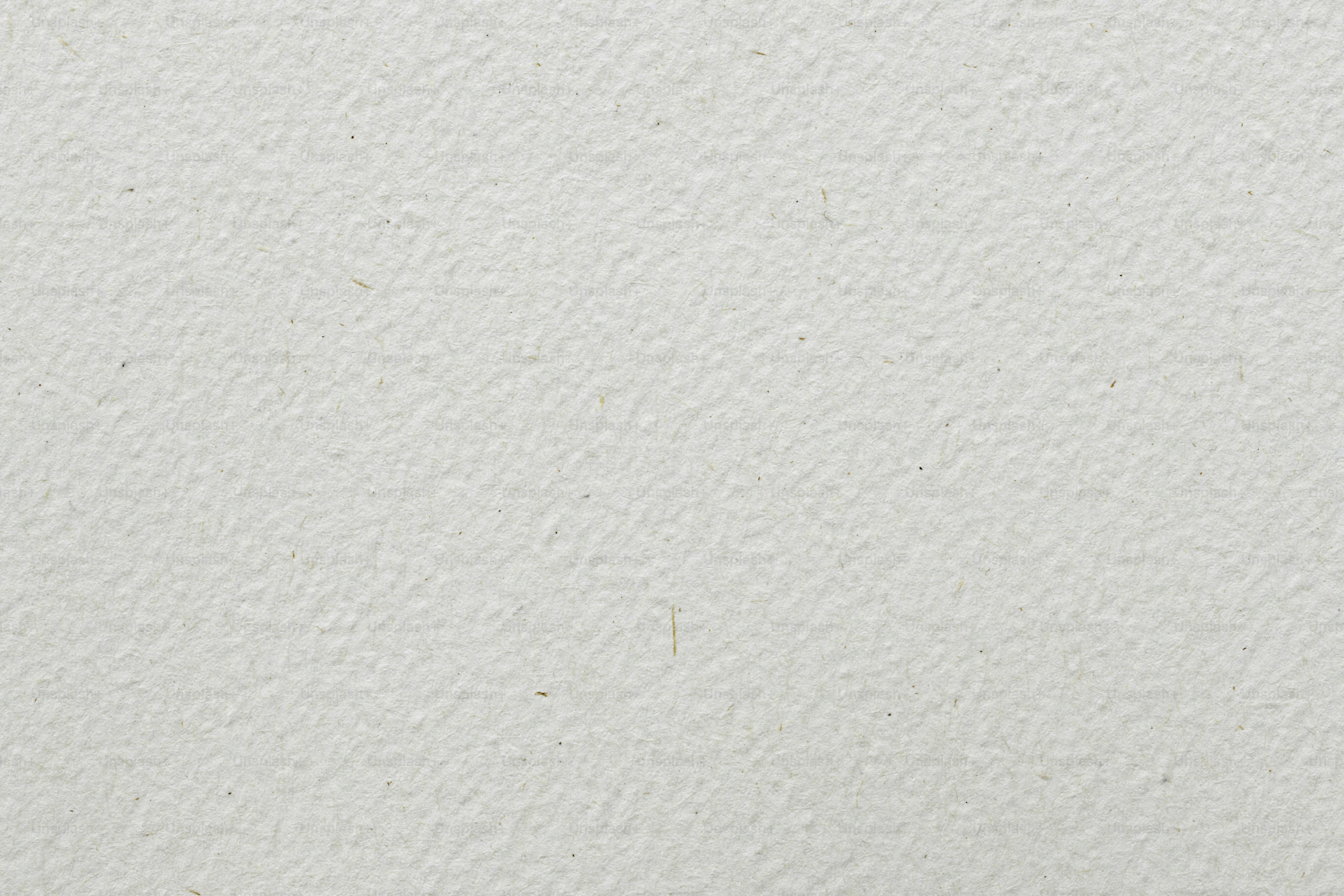 Un primo piano di un muro strutturato bianco