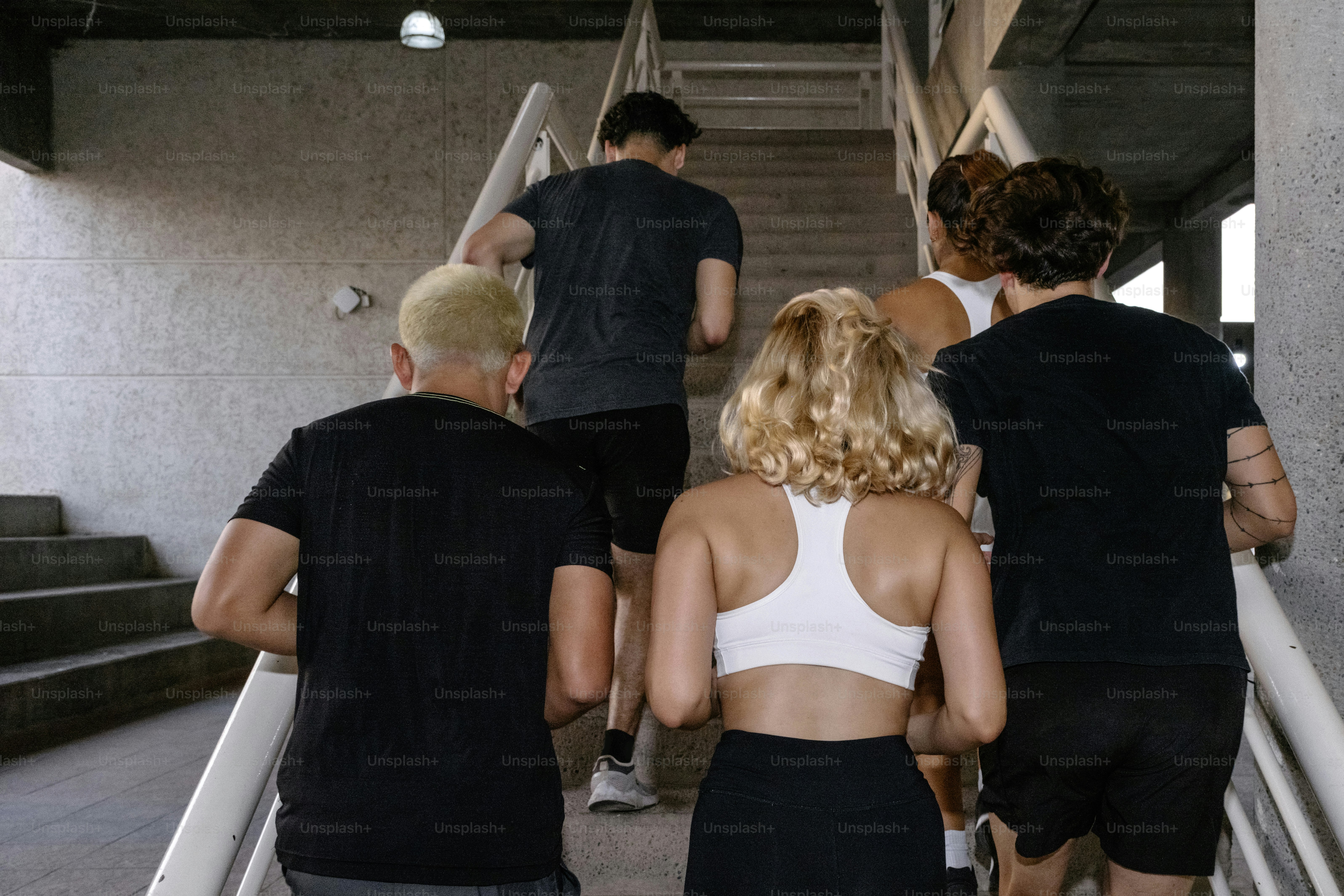 A group of people walking up a flight of stairs photo – Fitness Image ...