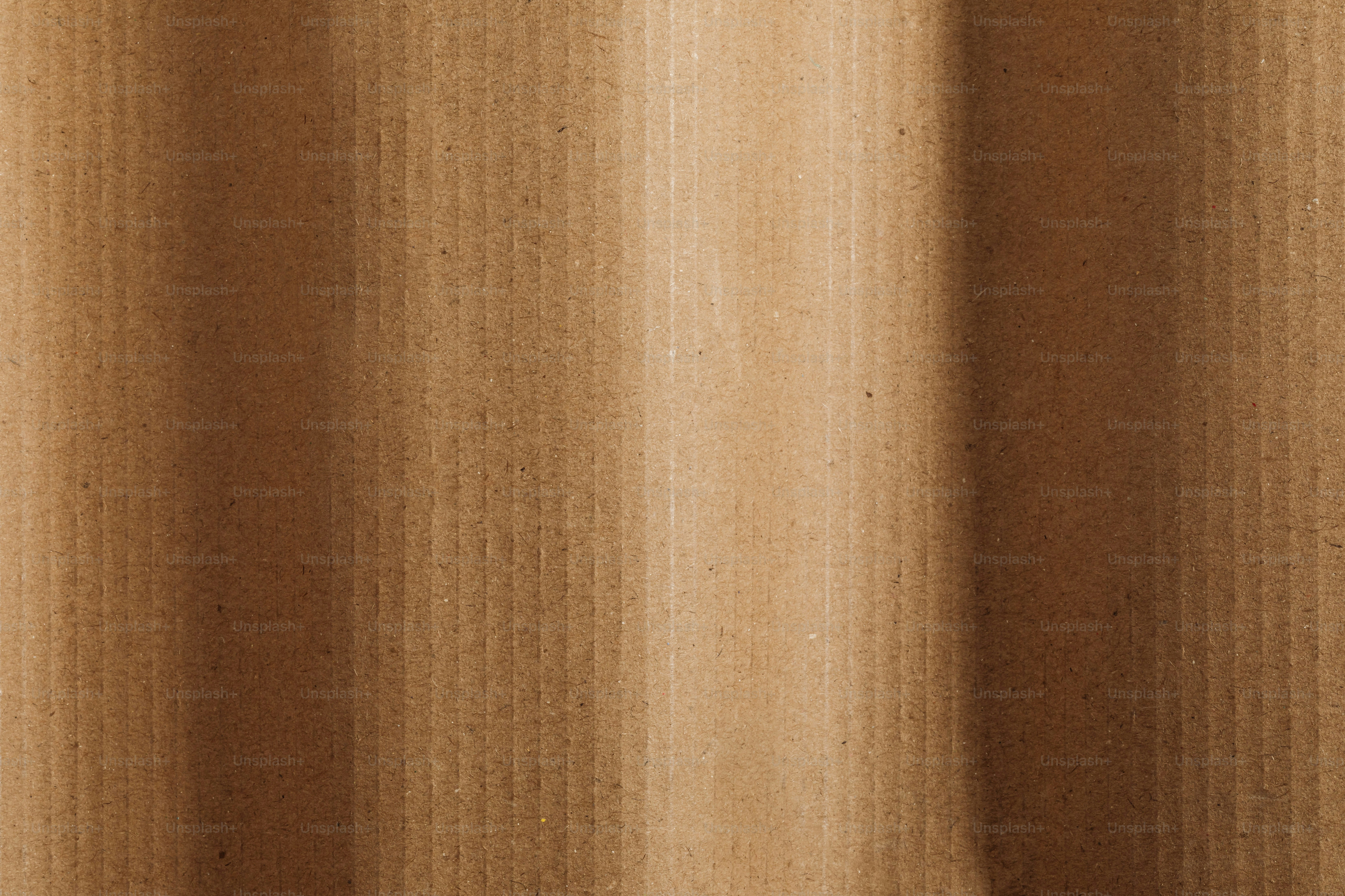 A close up of a curtain with a brown background