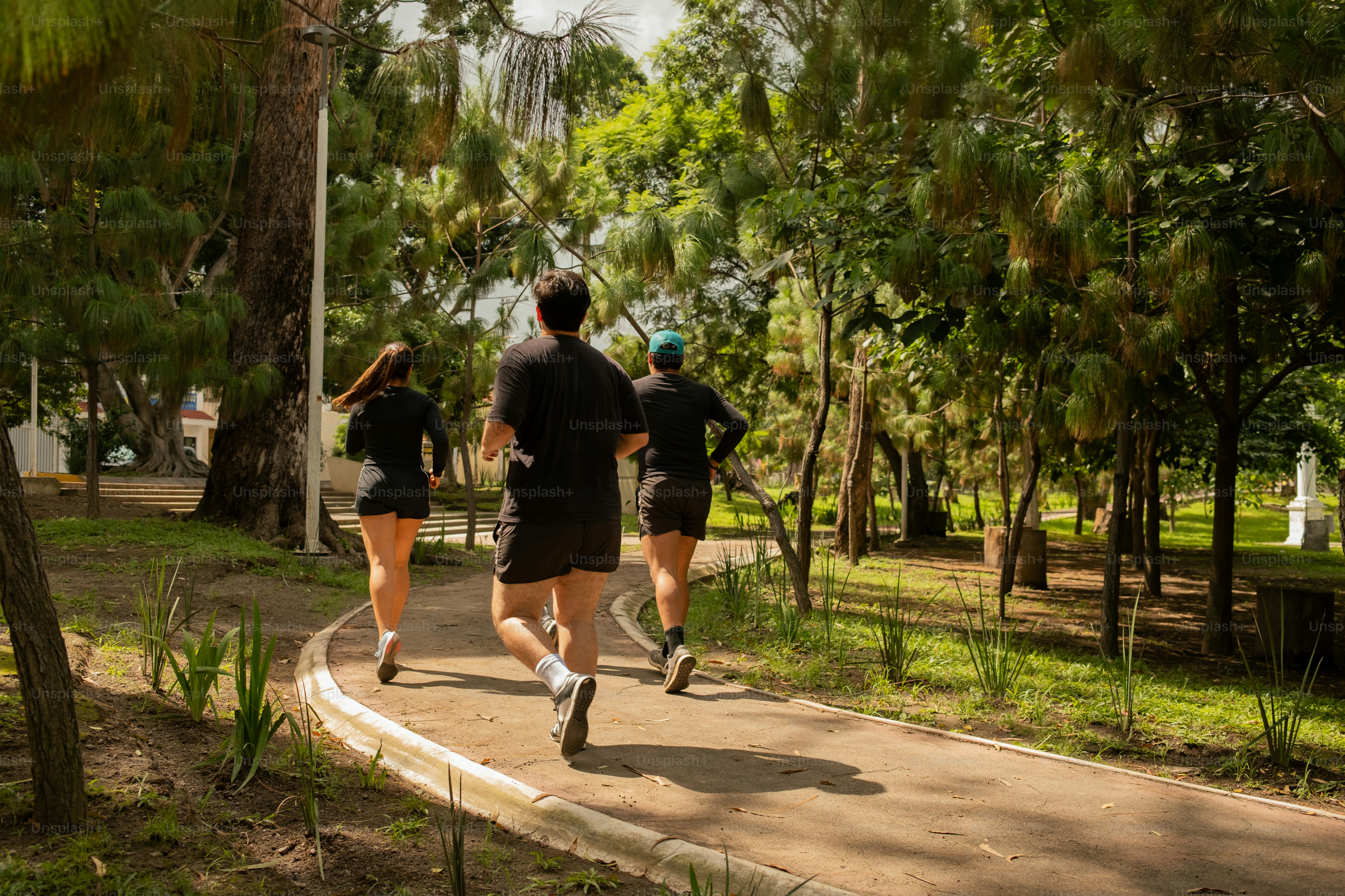A group of people walking down a street photo – Fitness Image on Unsplash