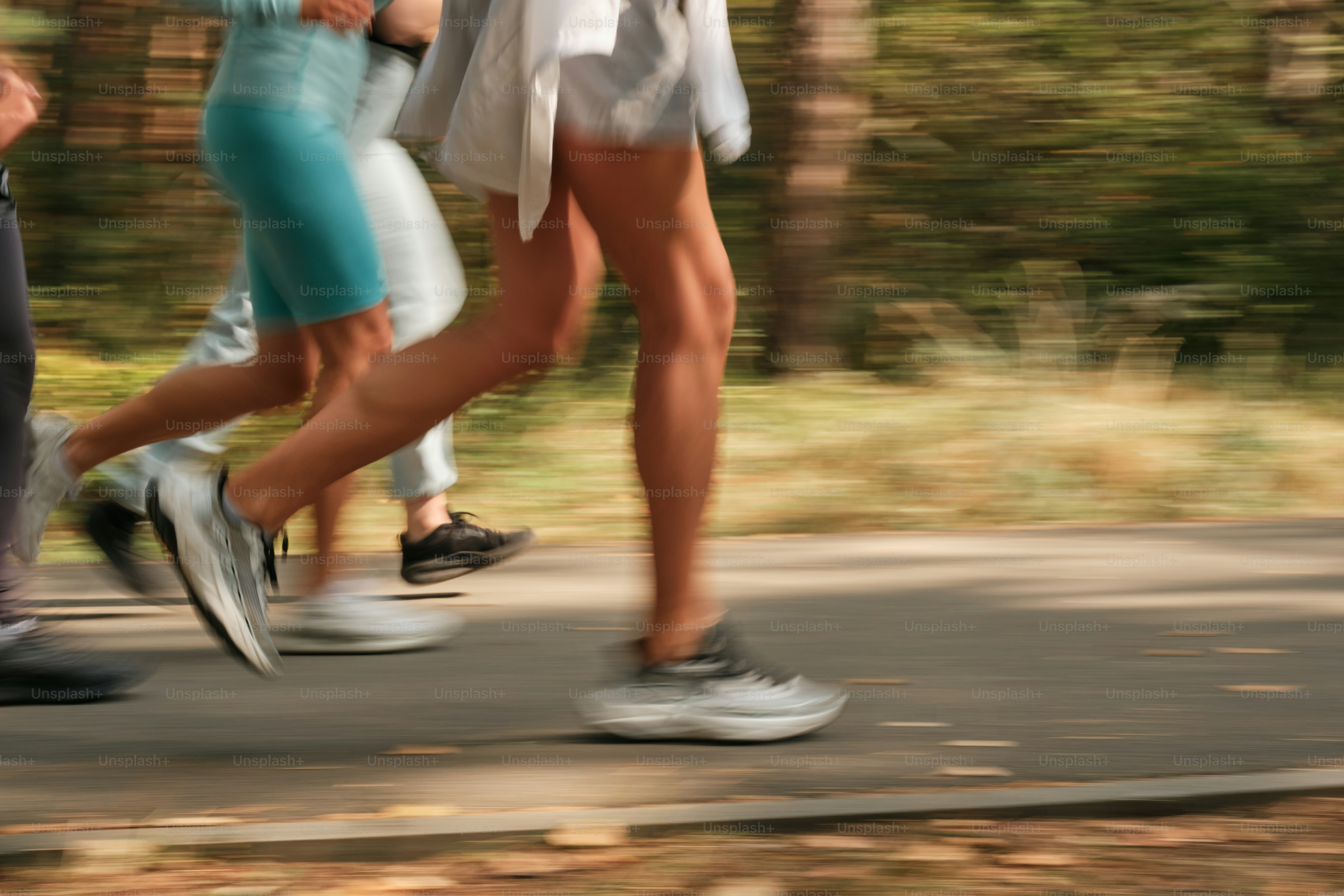 A group of people walking down a road