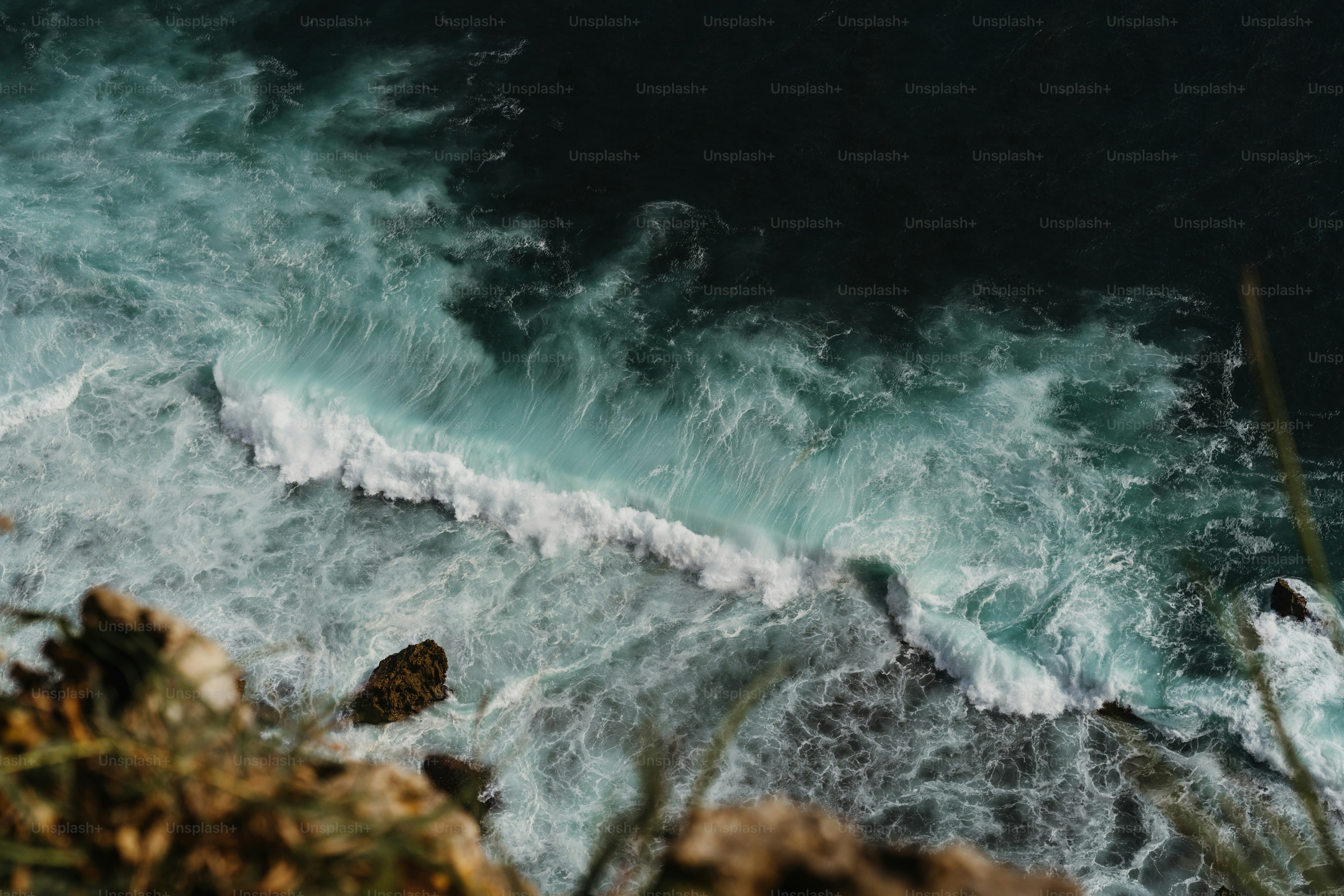 A man riding a surfboard on top of a wave