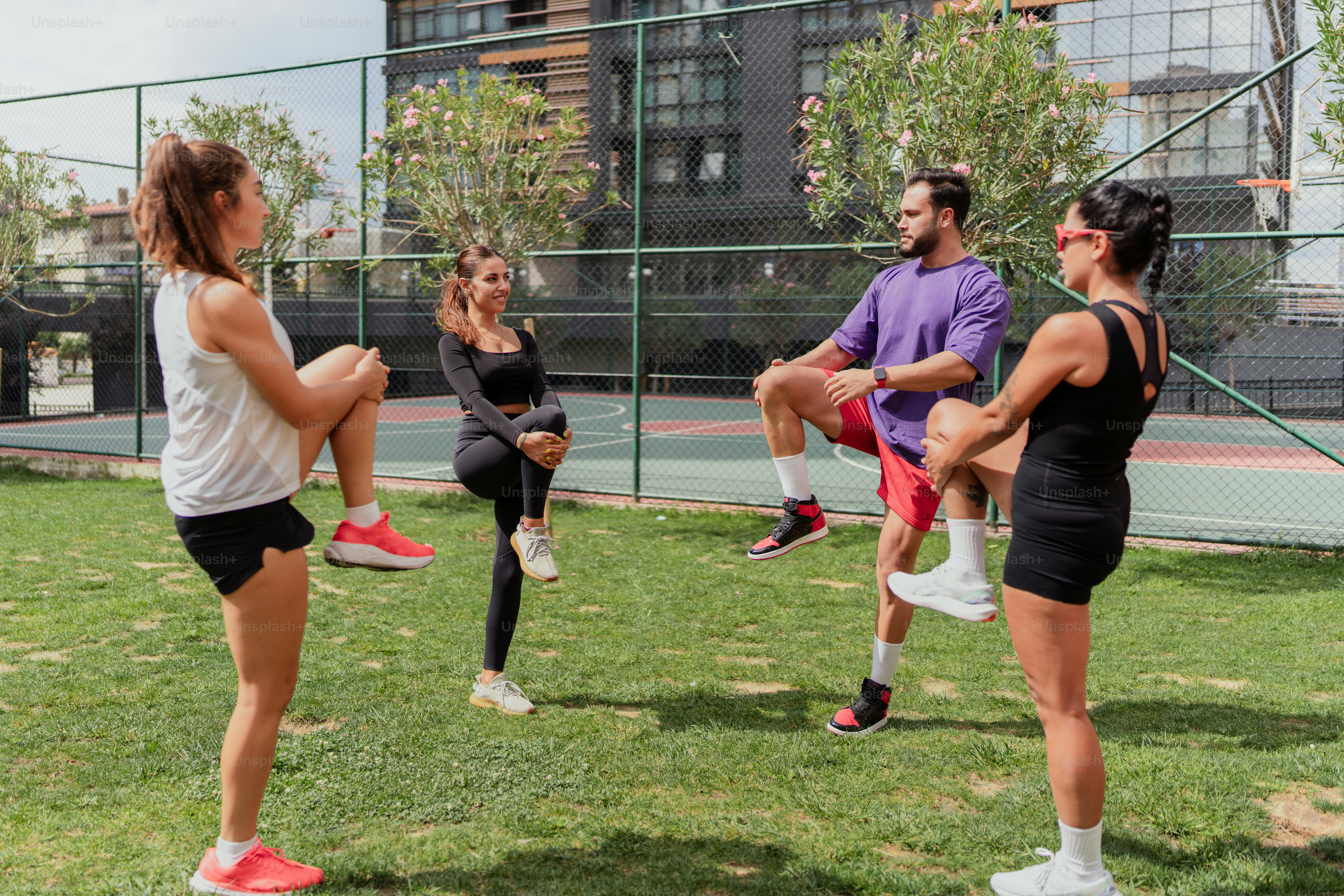 A group of people in a park doing exercises