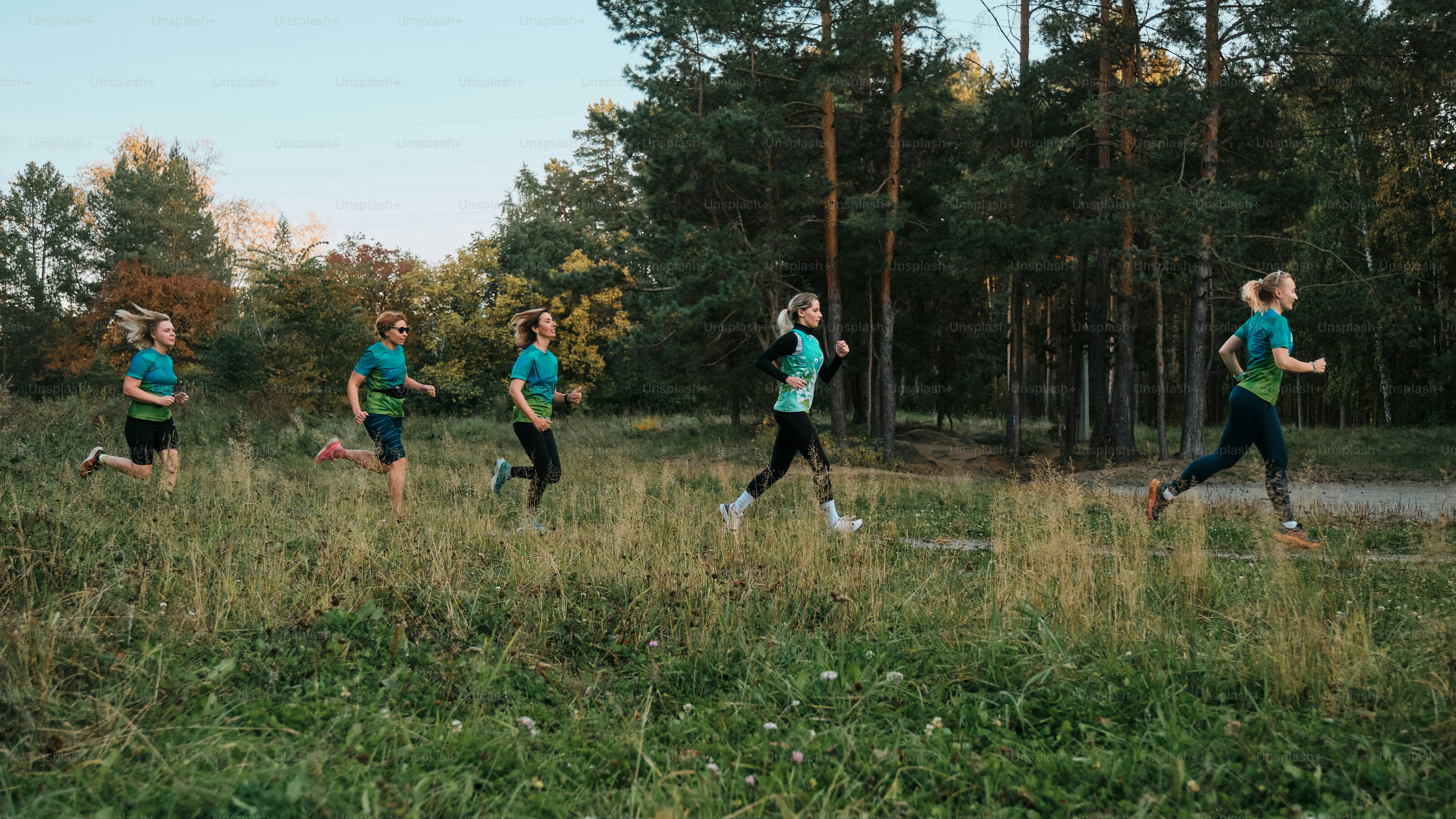A group of people running in a field