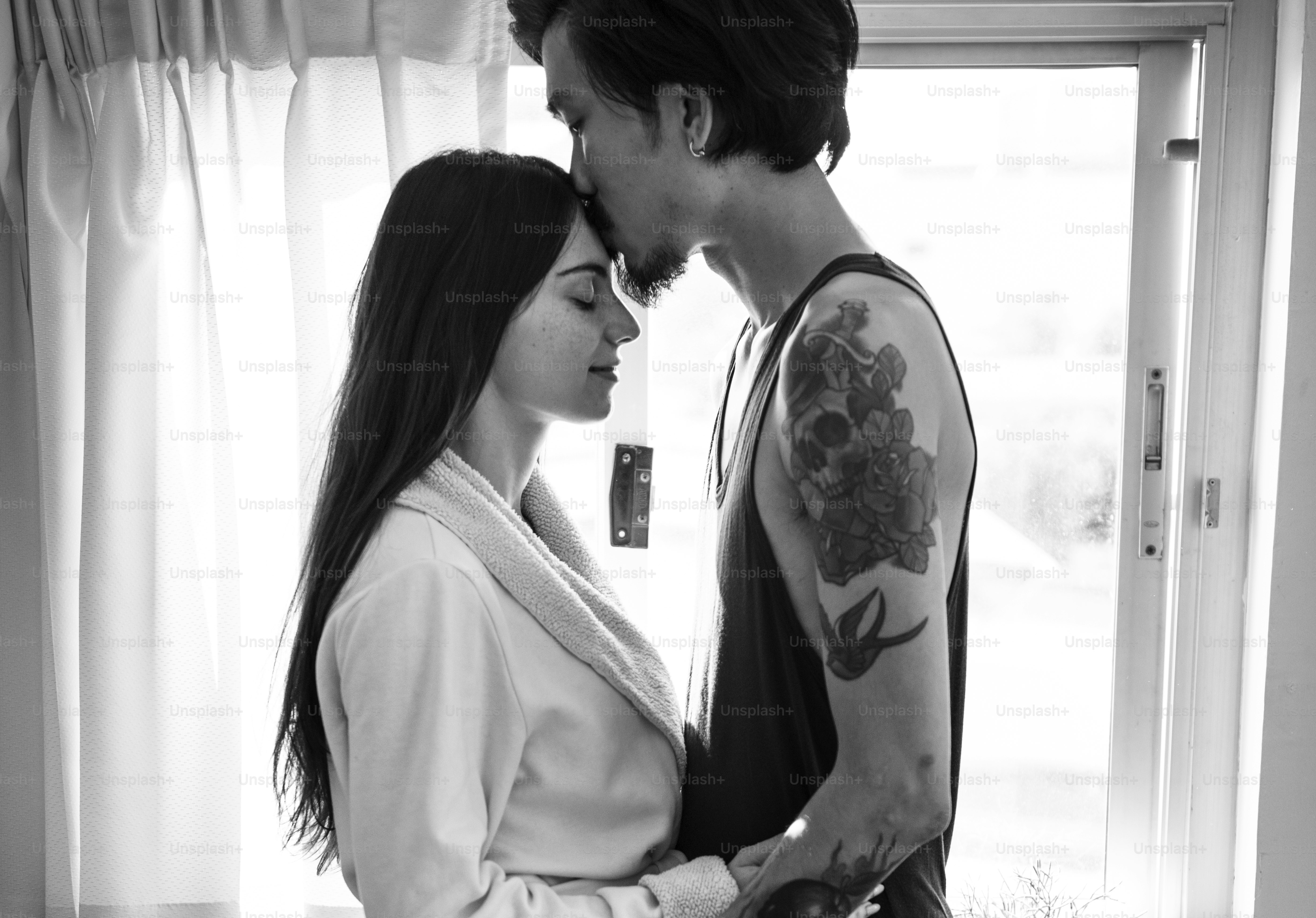 Couple is together in a house.