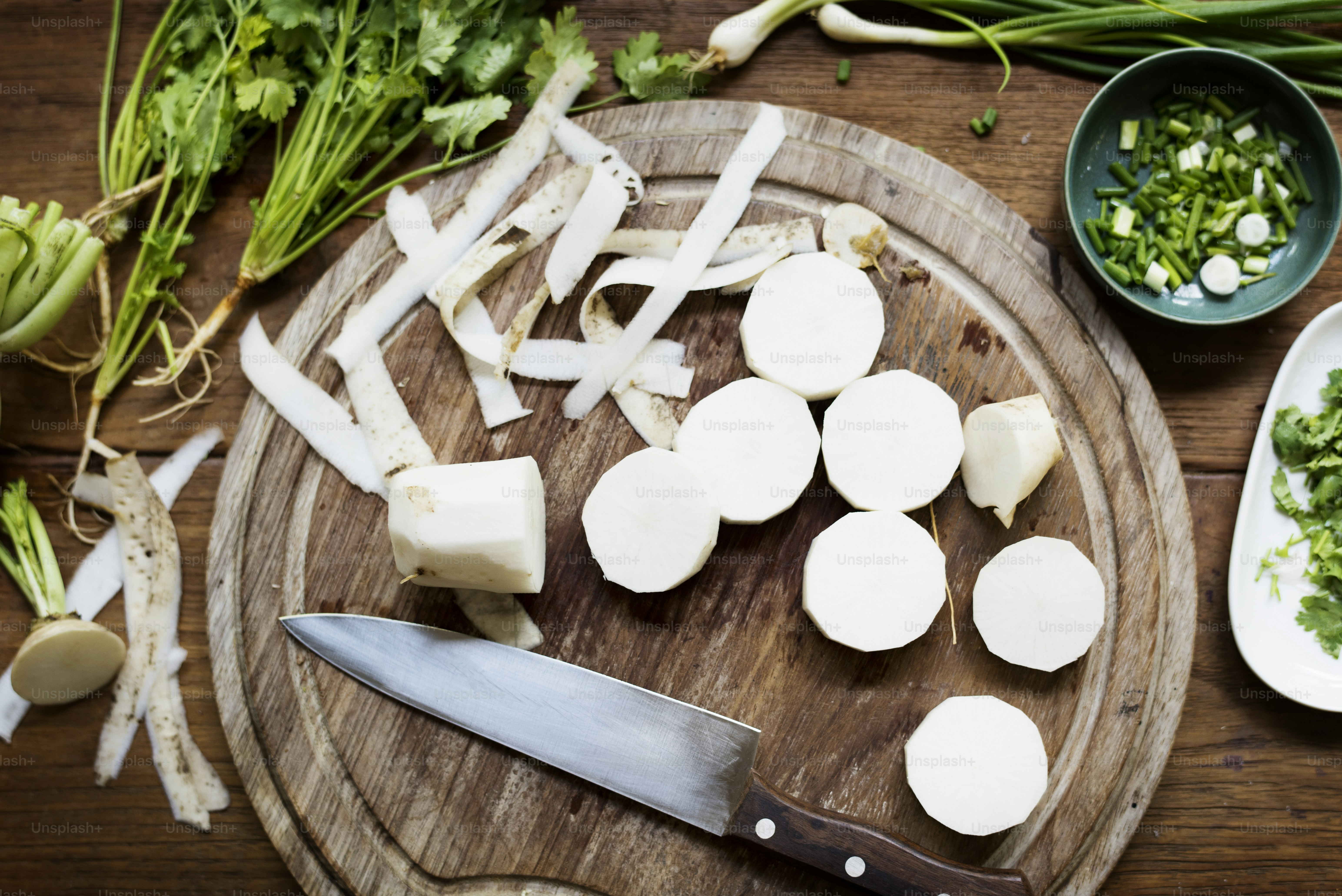 Closeup of fresh chinese white radish on wooden cut board