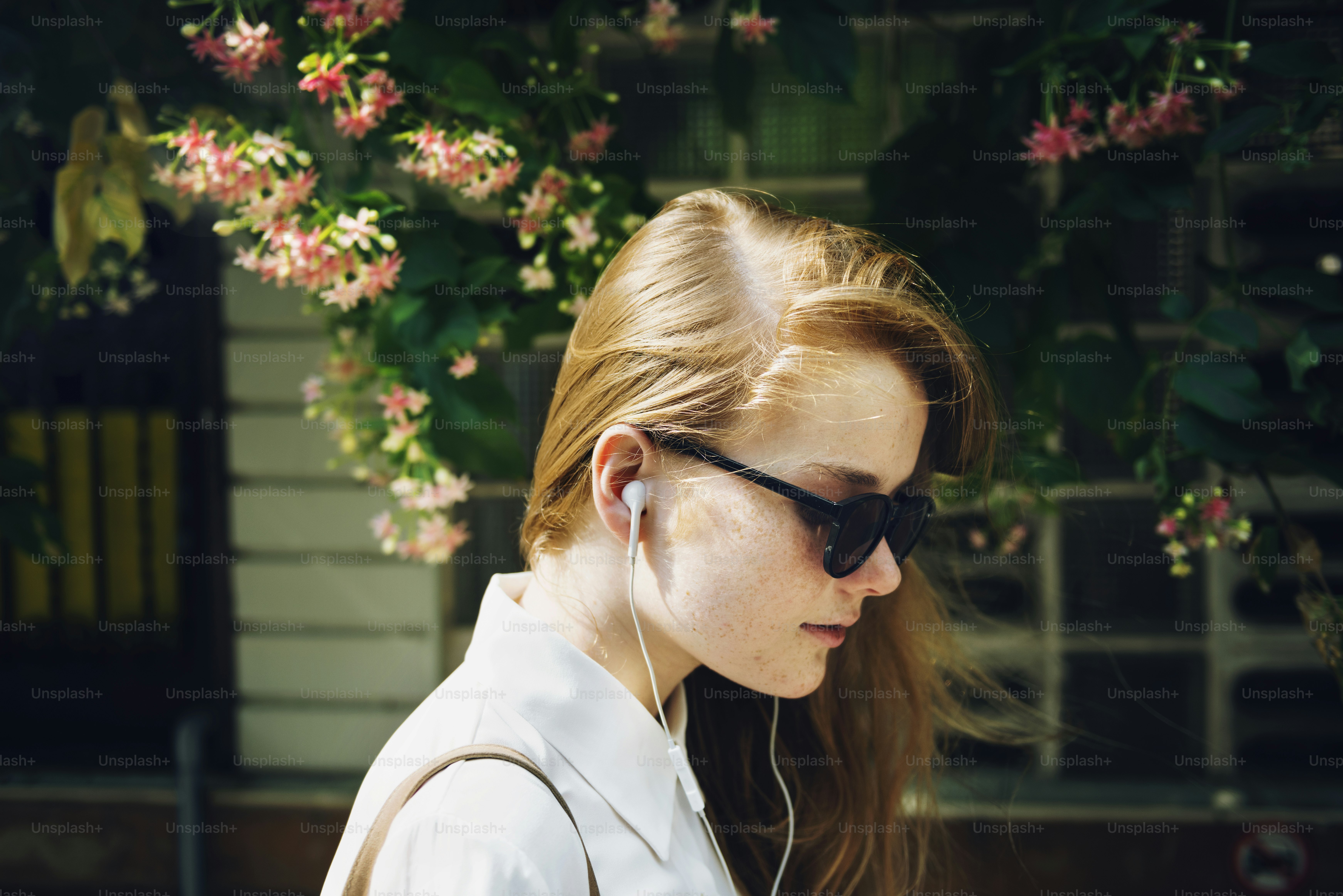 Person listening to audio with earbuds for a daily routine