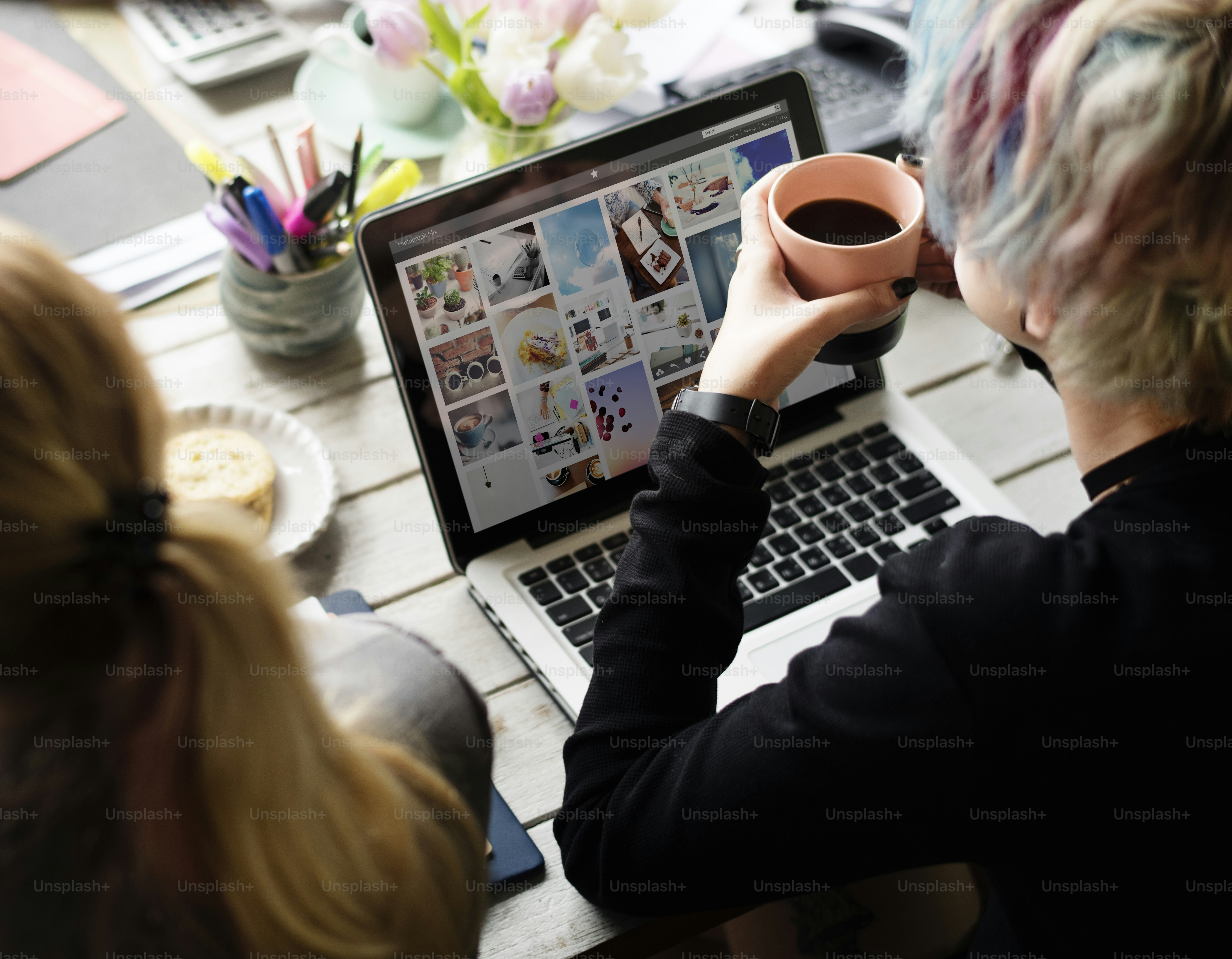 Woman Hands Holding Coffee Cup Working on Laptop