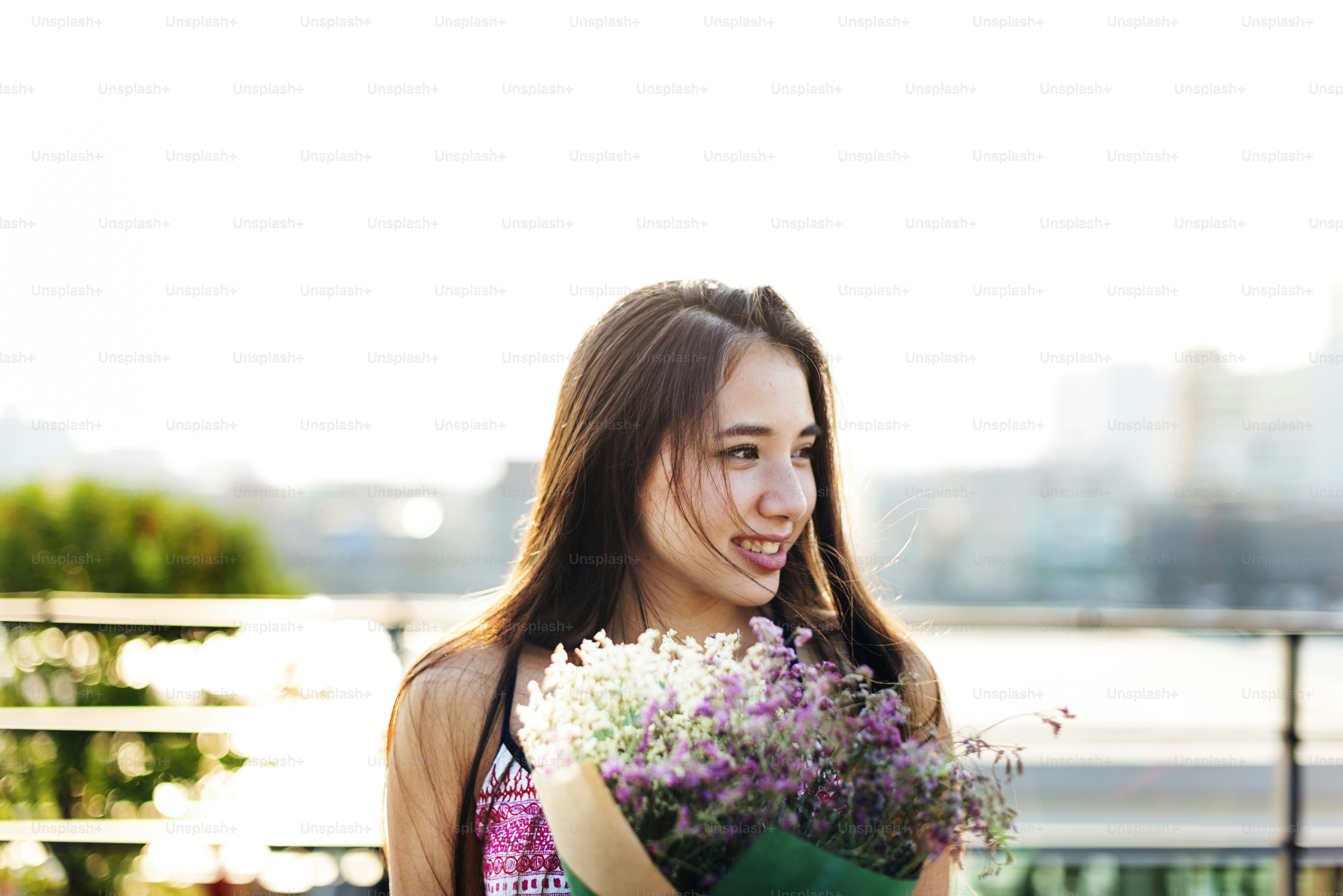 Young Happy Woman Holding Flowers Concept