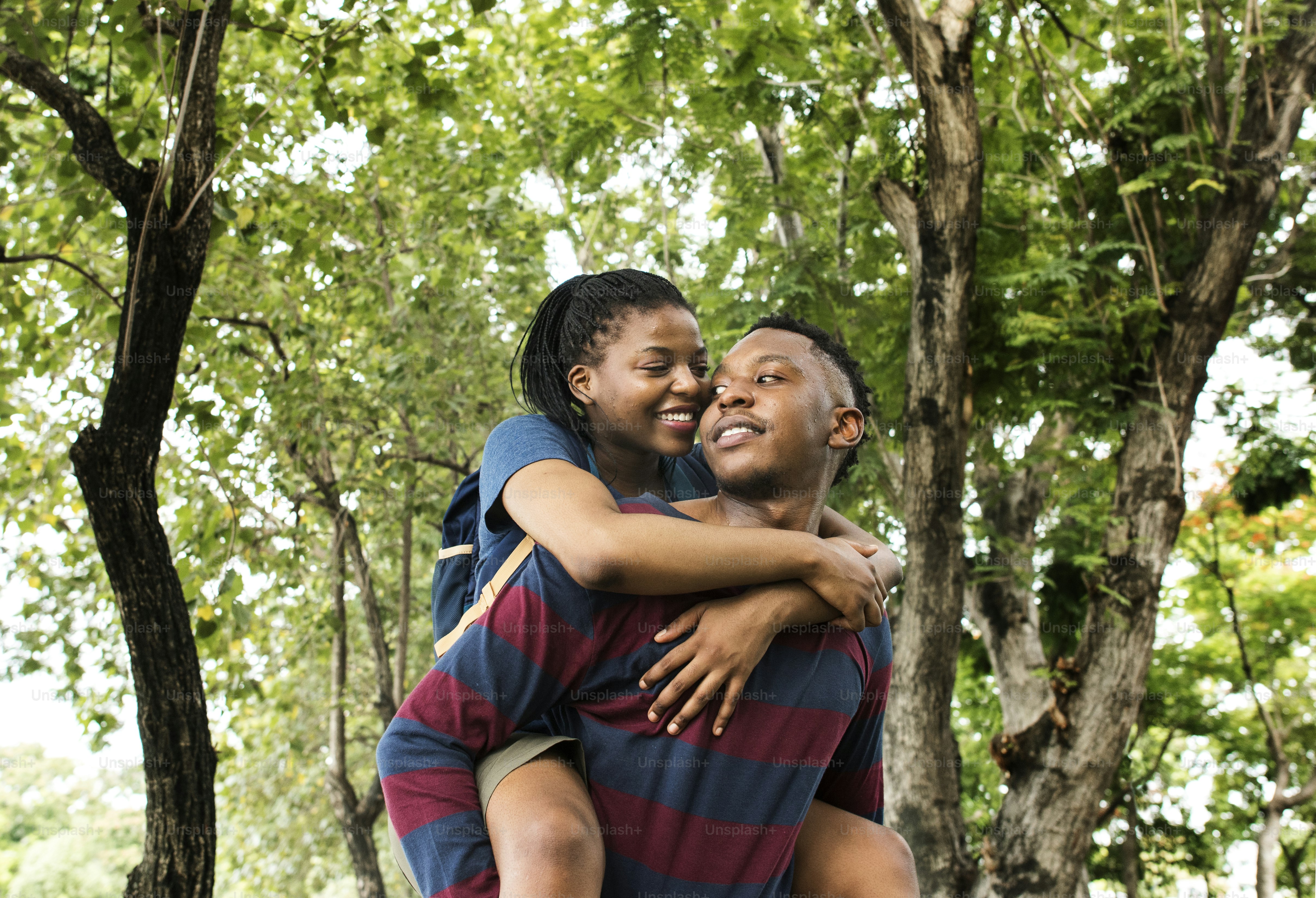 Man giving his girlfriend a piggyback ride