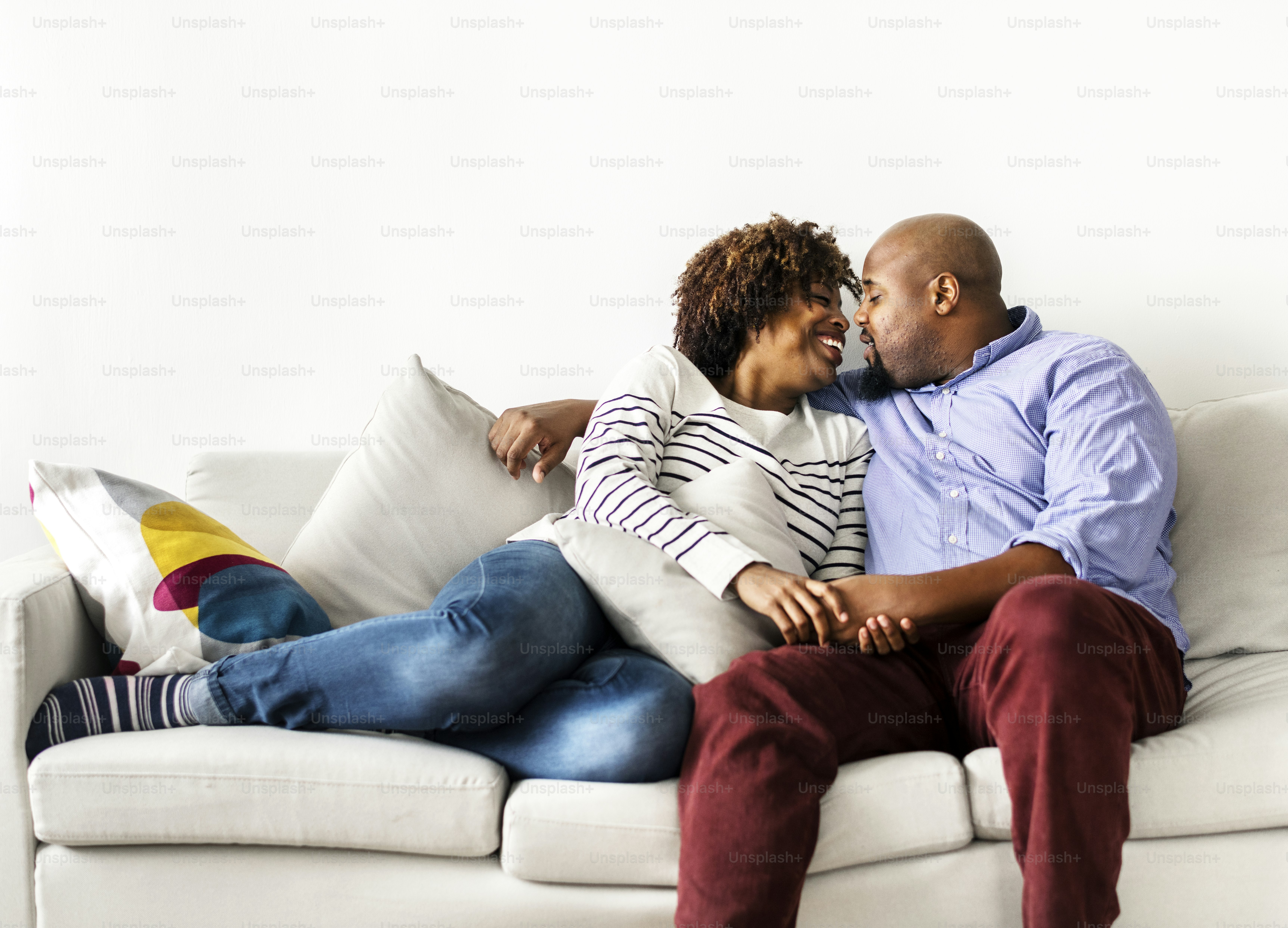 Happy couple relaxing at home