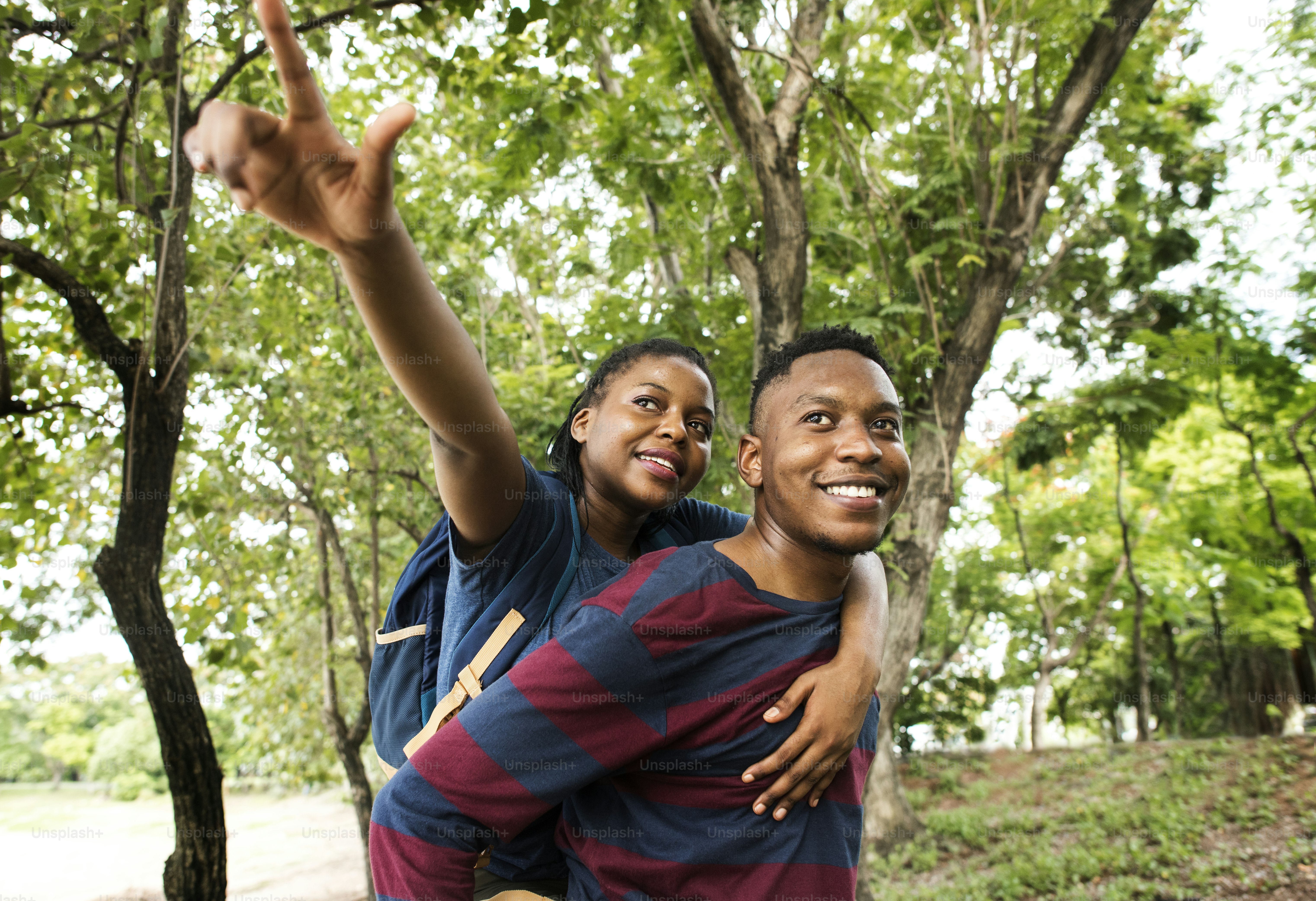 Man giving his girlfriend a piggyback ride