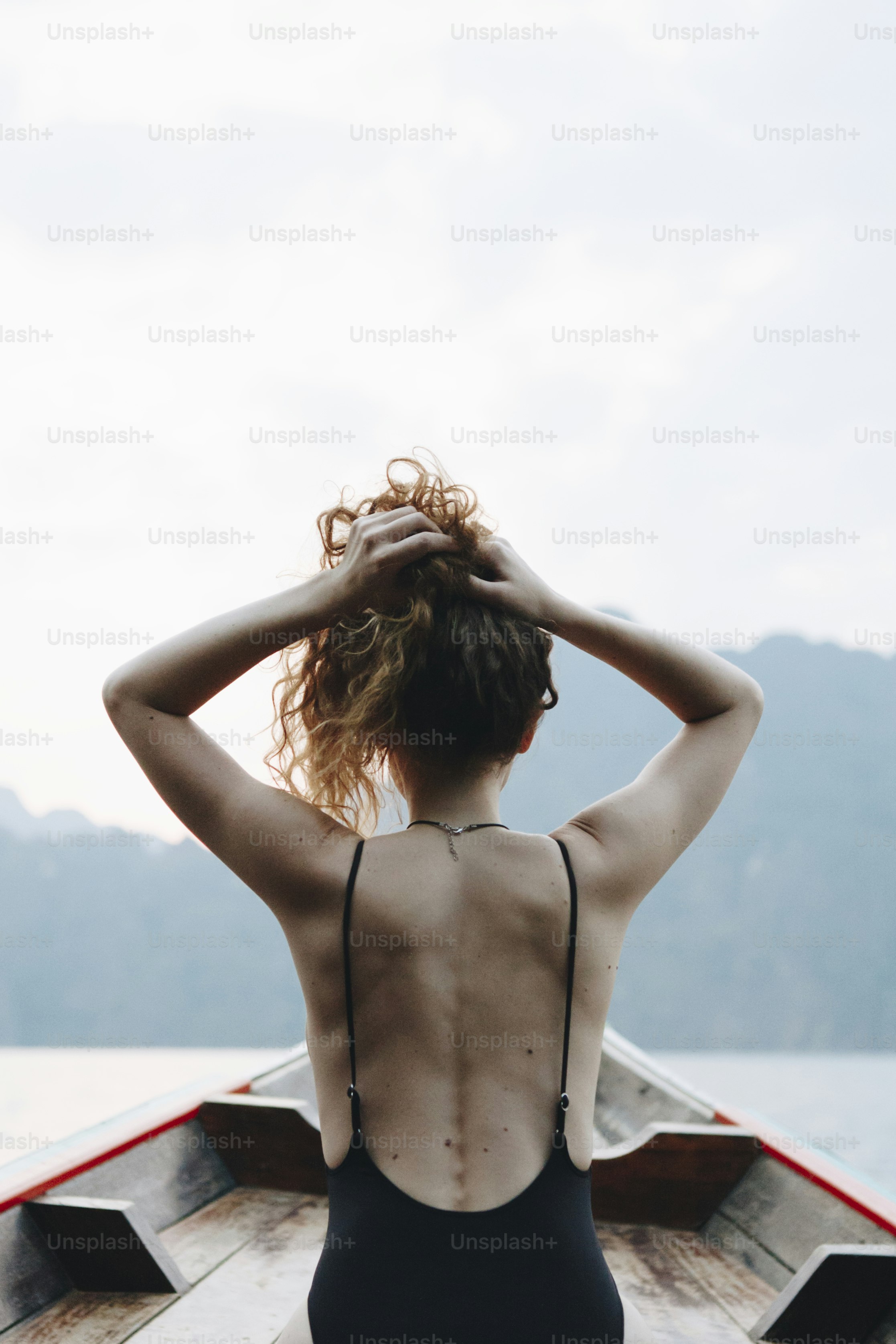 Beautiful woman posing on a boat
