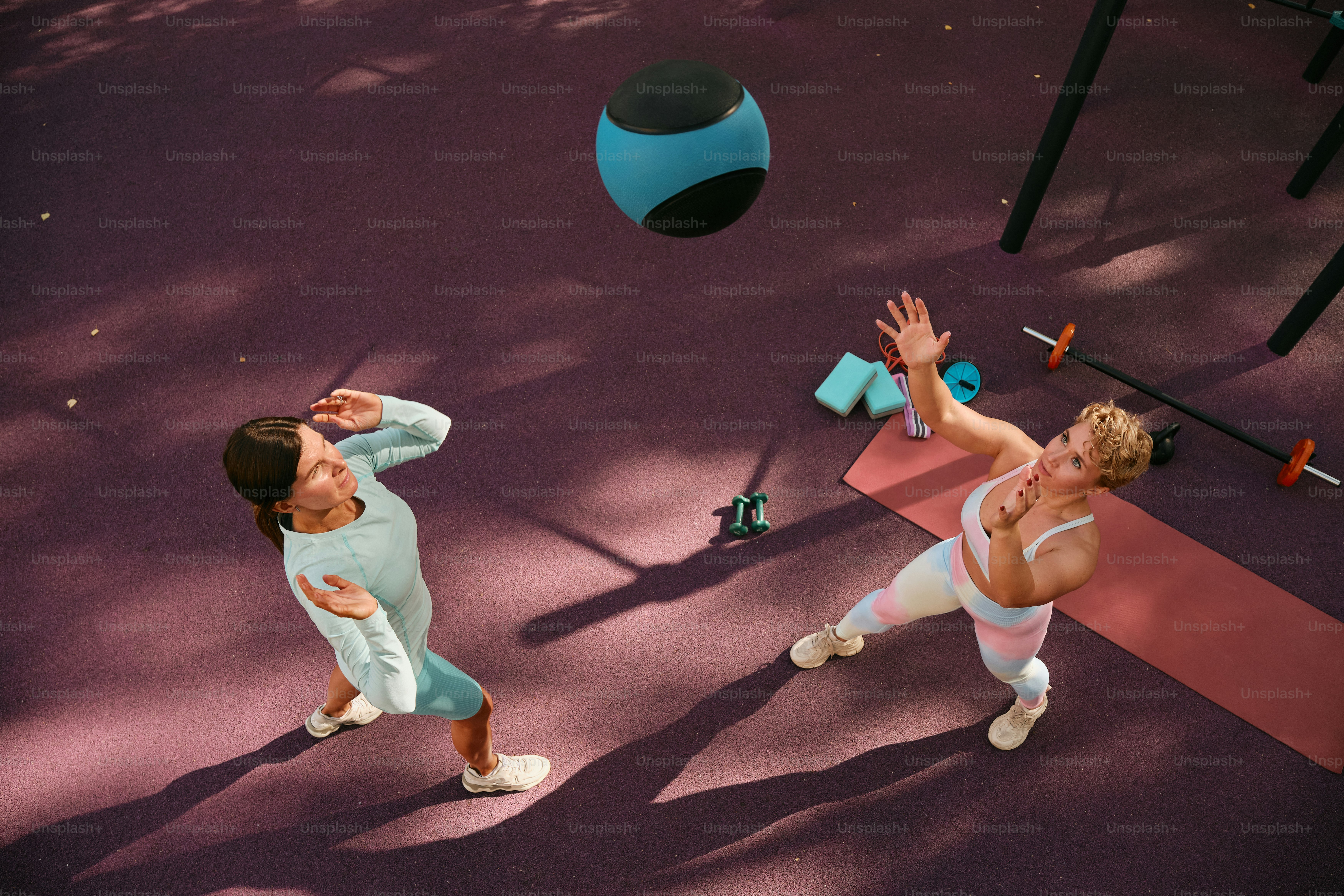 Personal trainer doing fitness training on the street ground