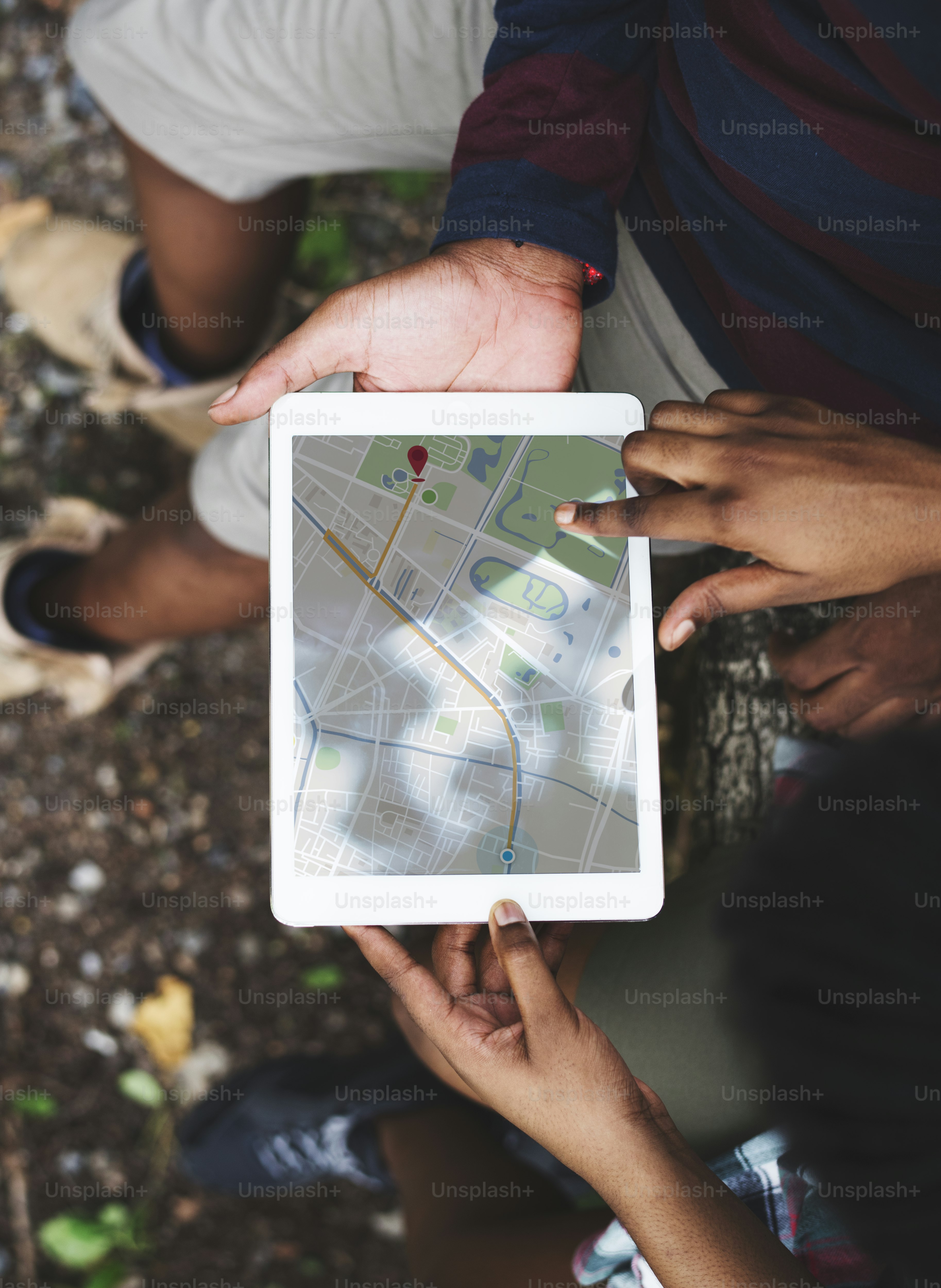 Checking the map on a tablet ***These graphics are derived from our own 3D generic designs. They do not infringe on any copyright design.