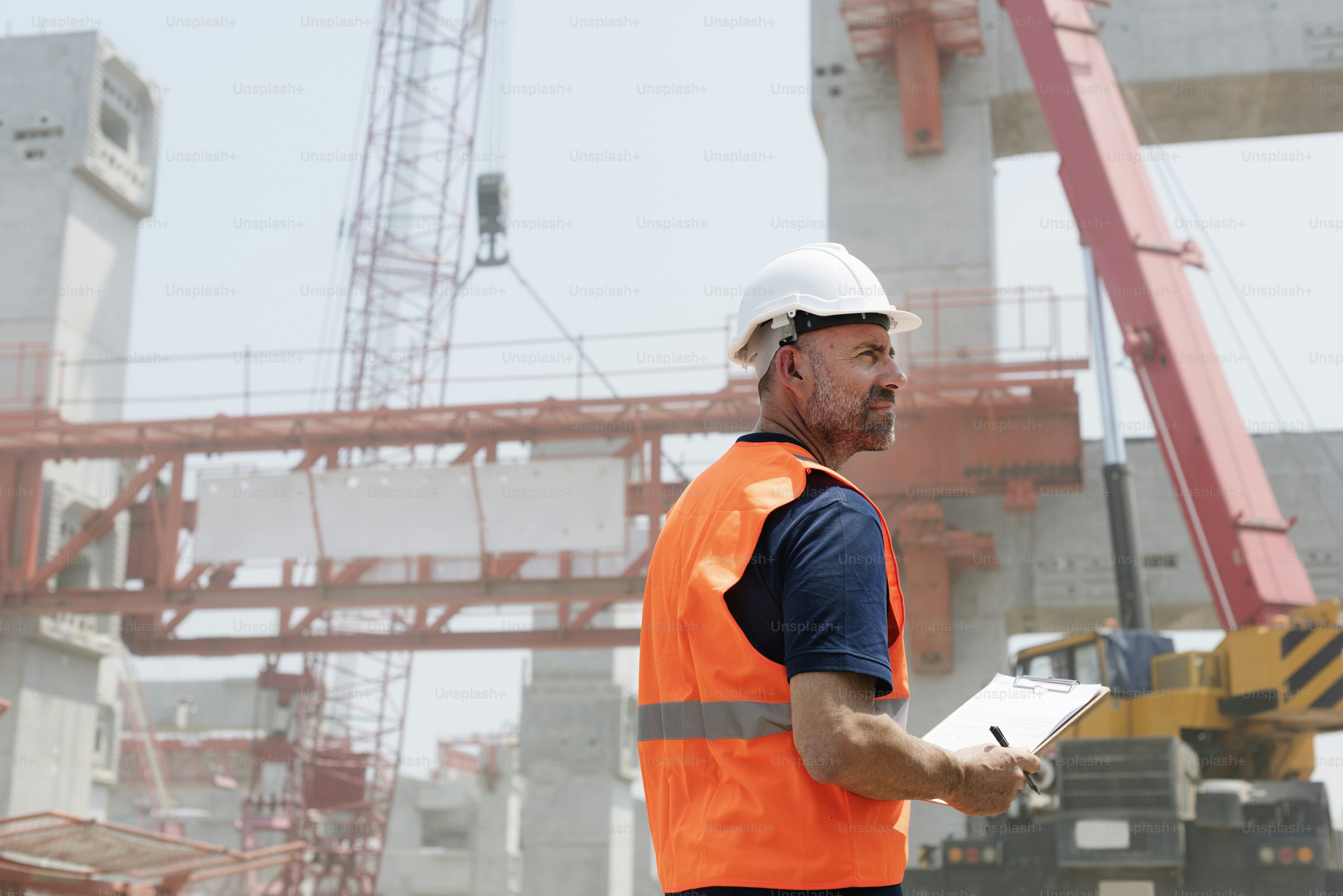 Project manager reviewing contractor workforce planning schedule on a tablet