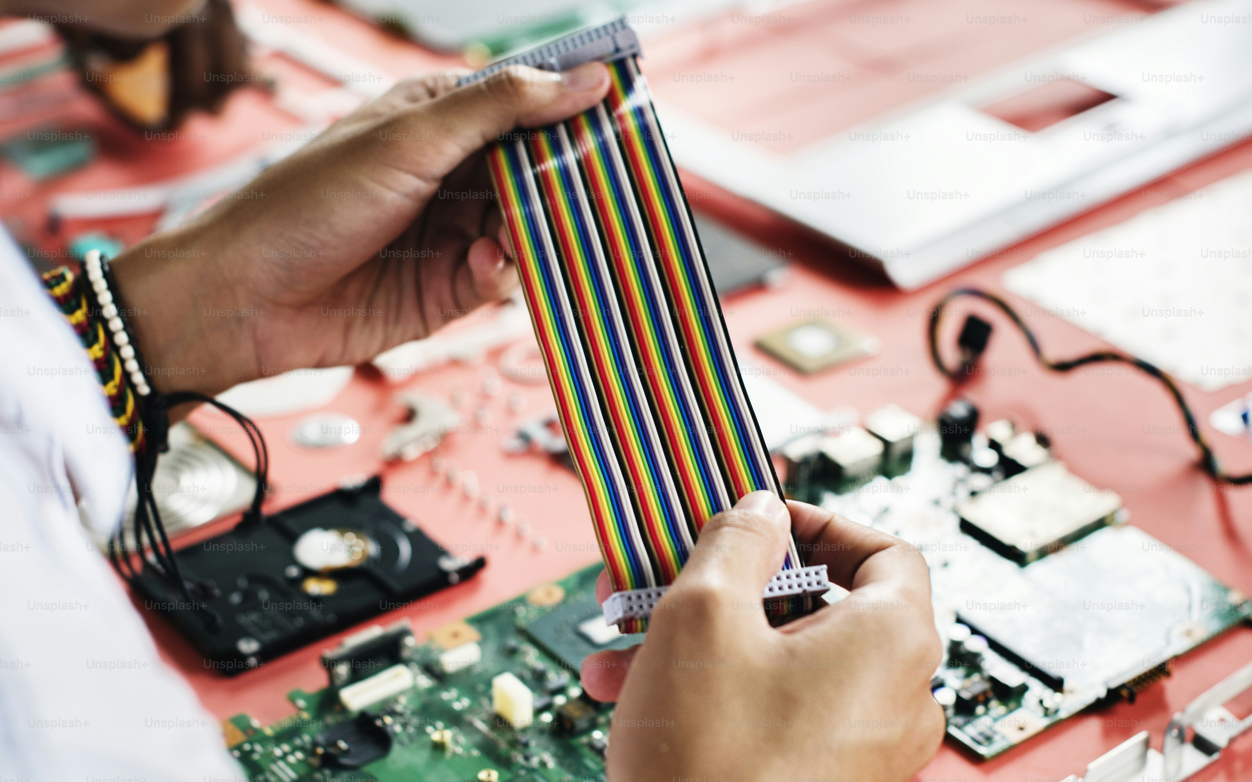 Clsoeup of hands holding computer breadboard flat wires cables photo ...