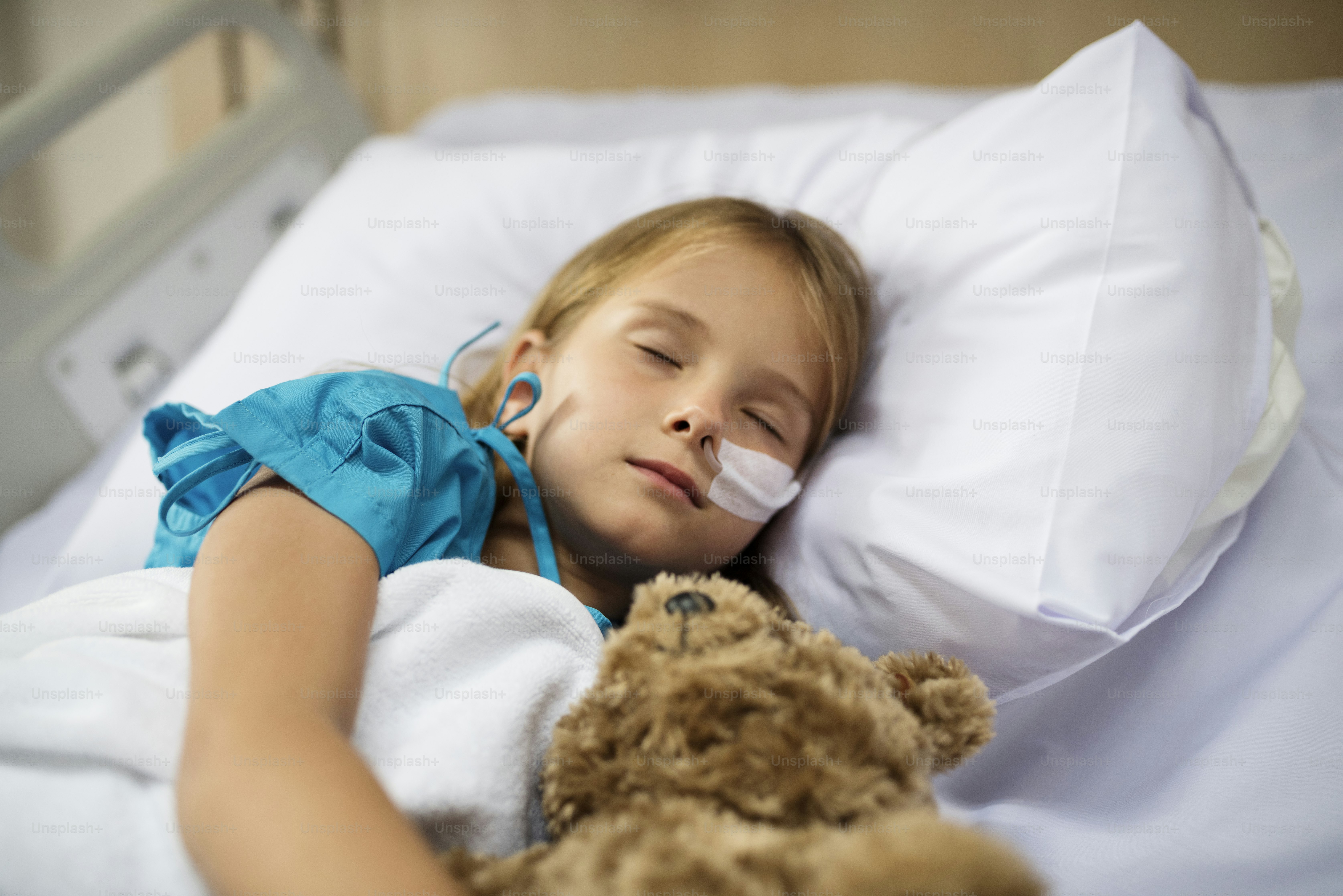 Young Caucasian girl is staying at the hospital