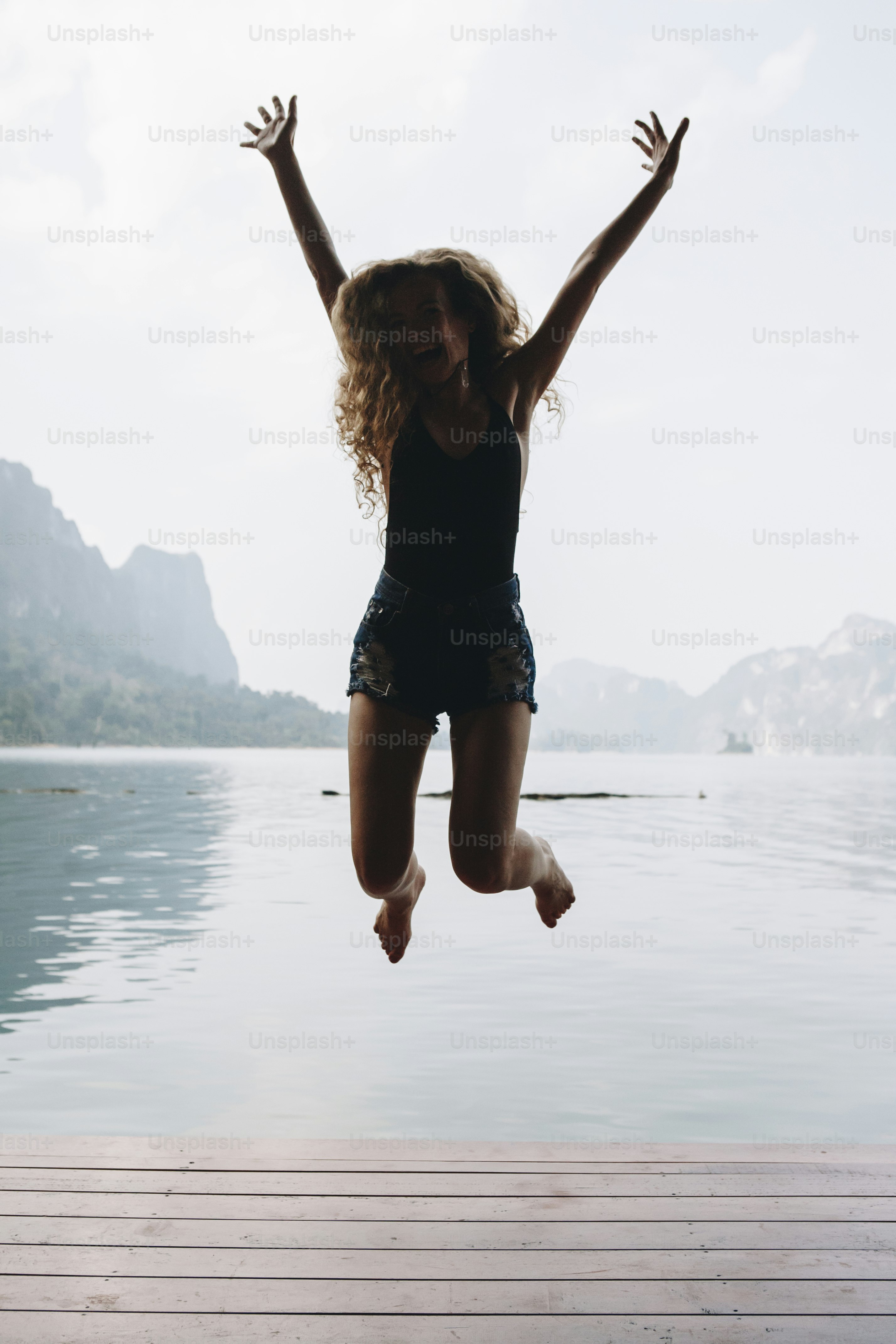 Happy woman jumping with joy