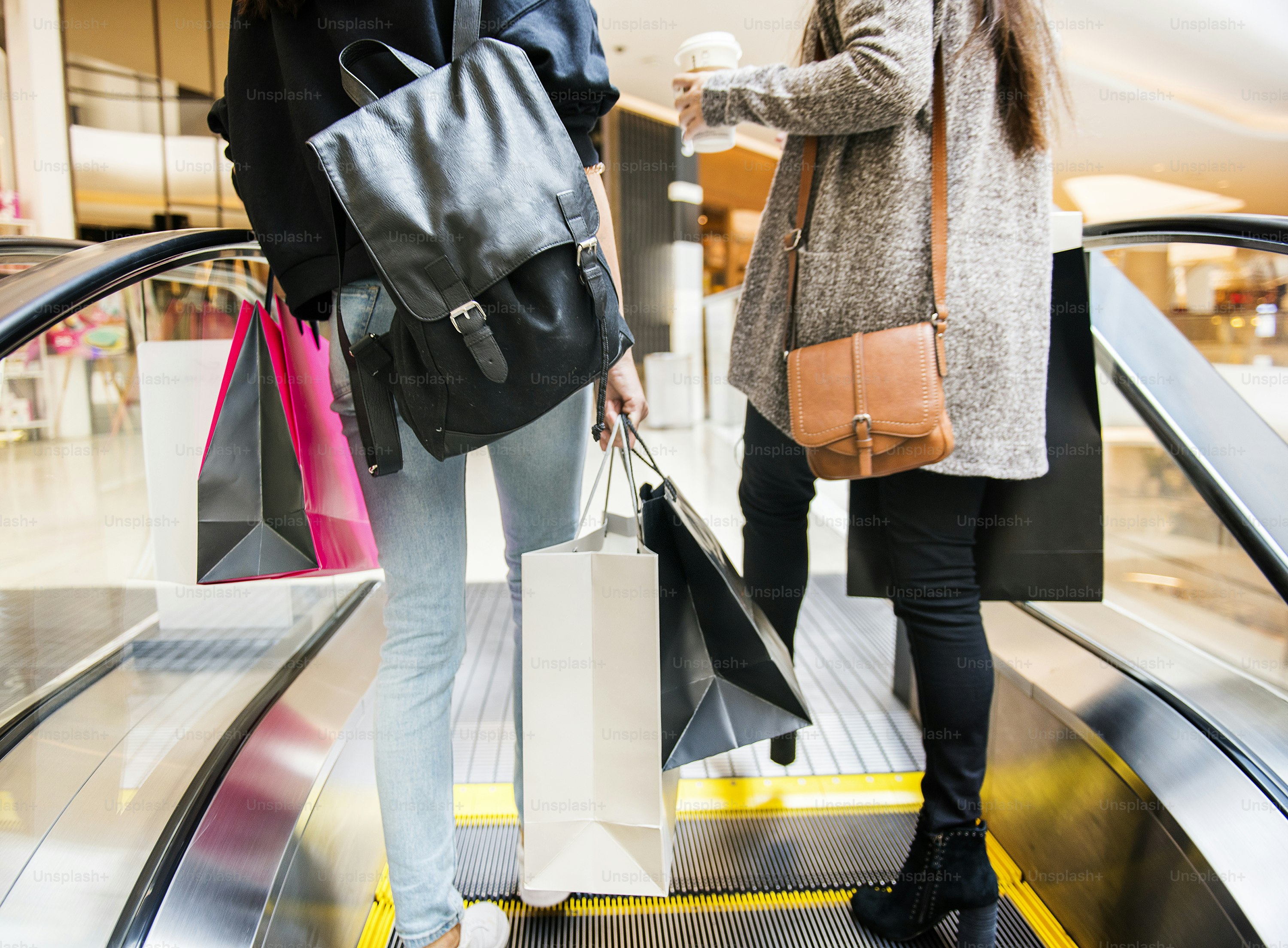 Two women enjoy shopping concept