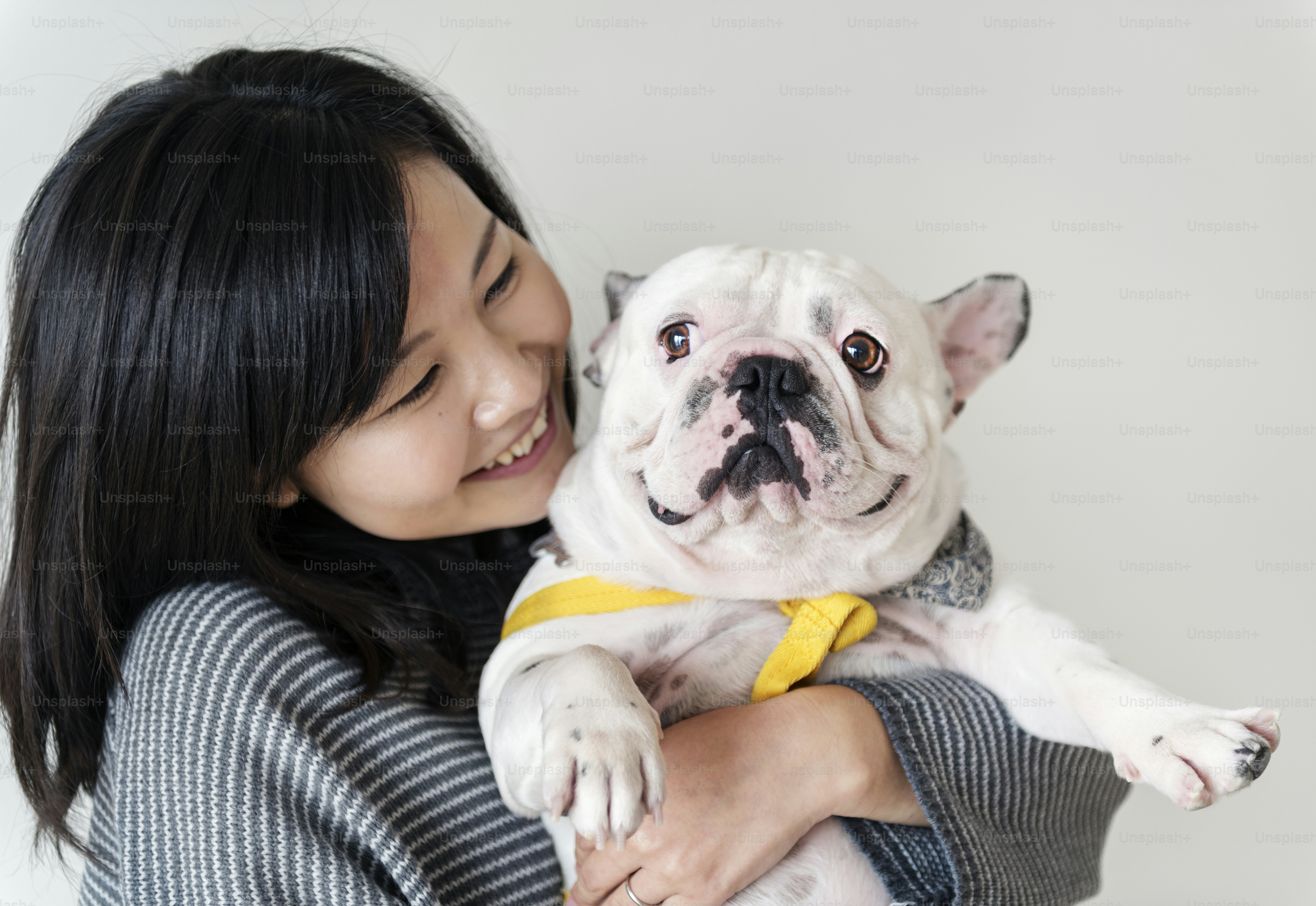 Asian woman hugging dog