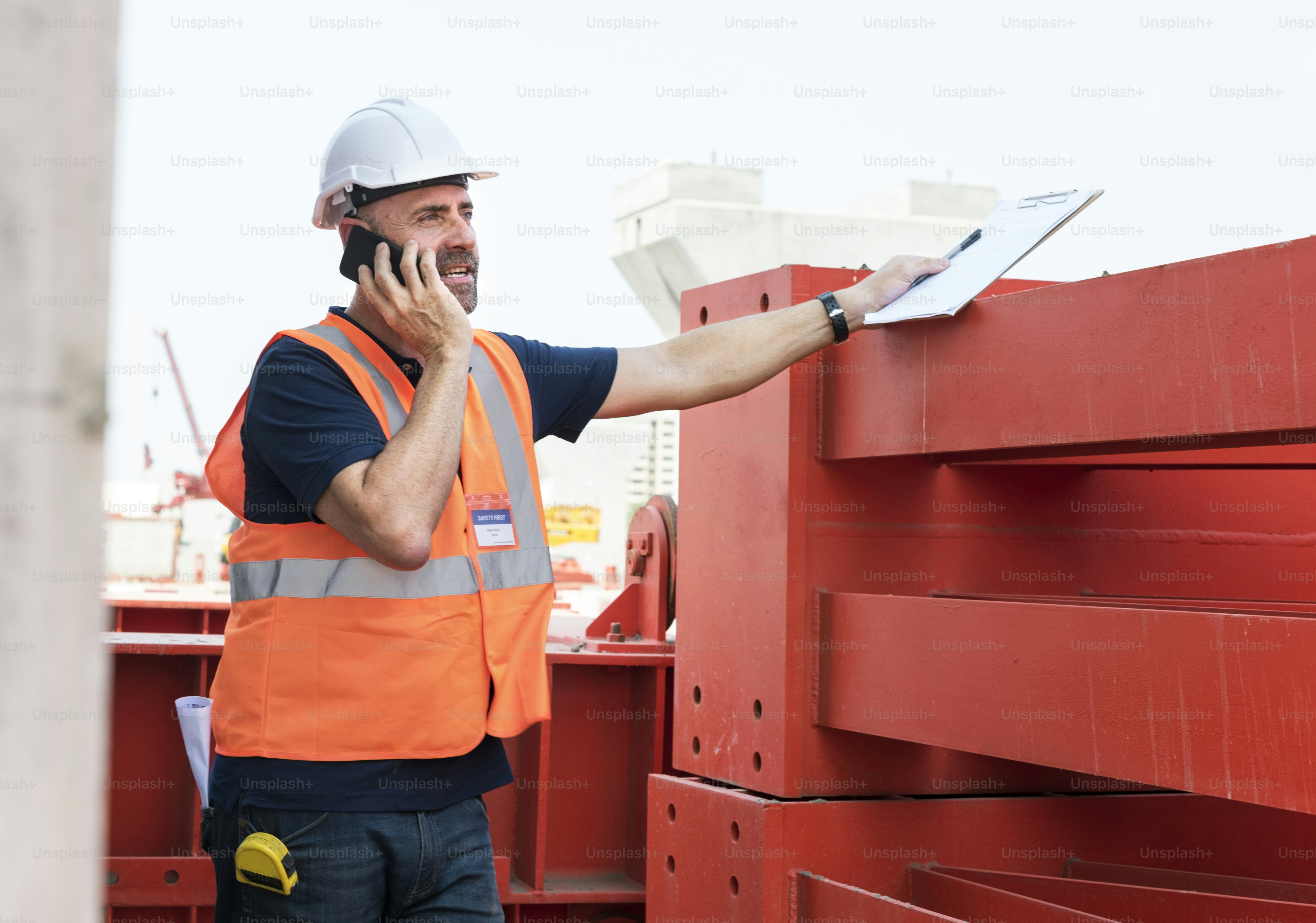 Site engineer on a construction site photo – Business finance and ...