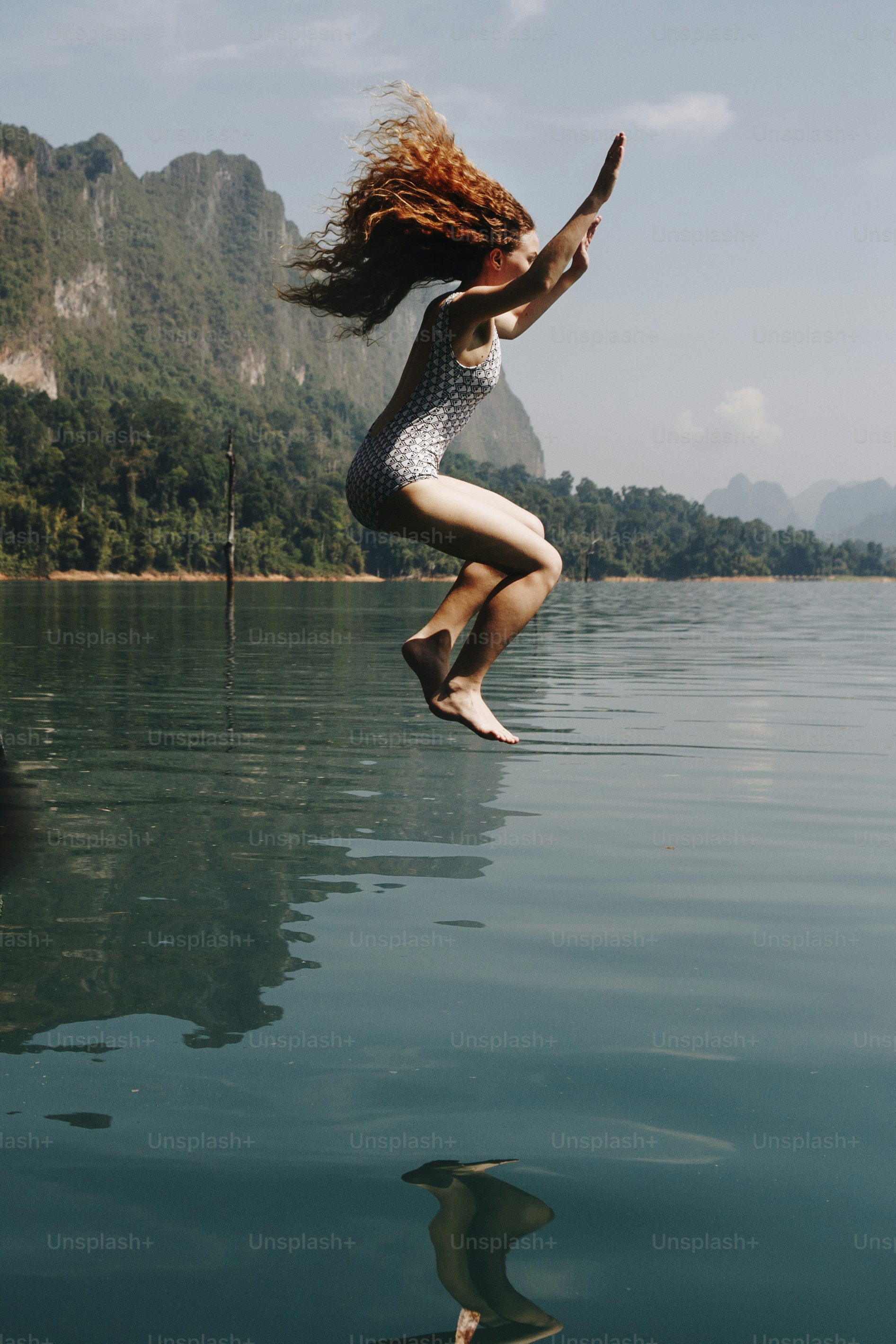 Woman jumping into the water