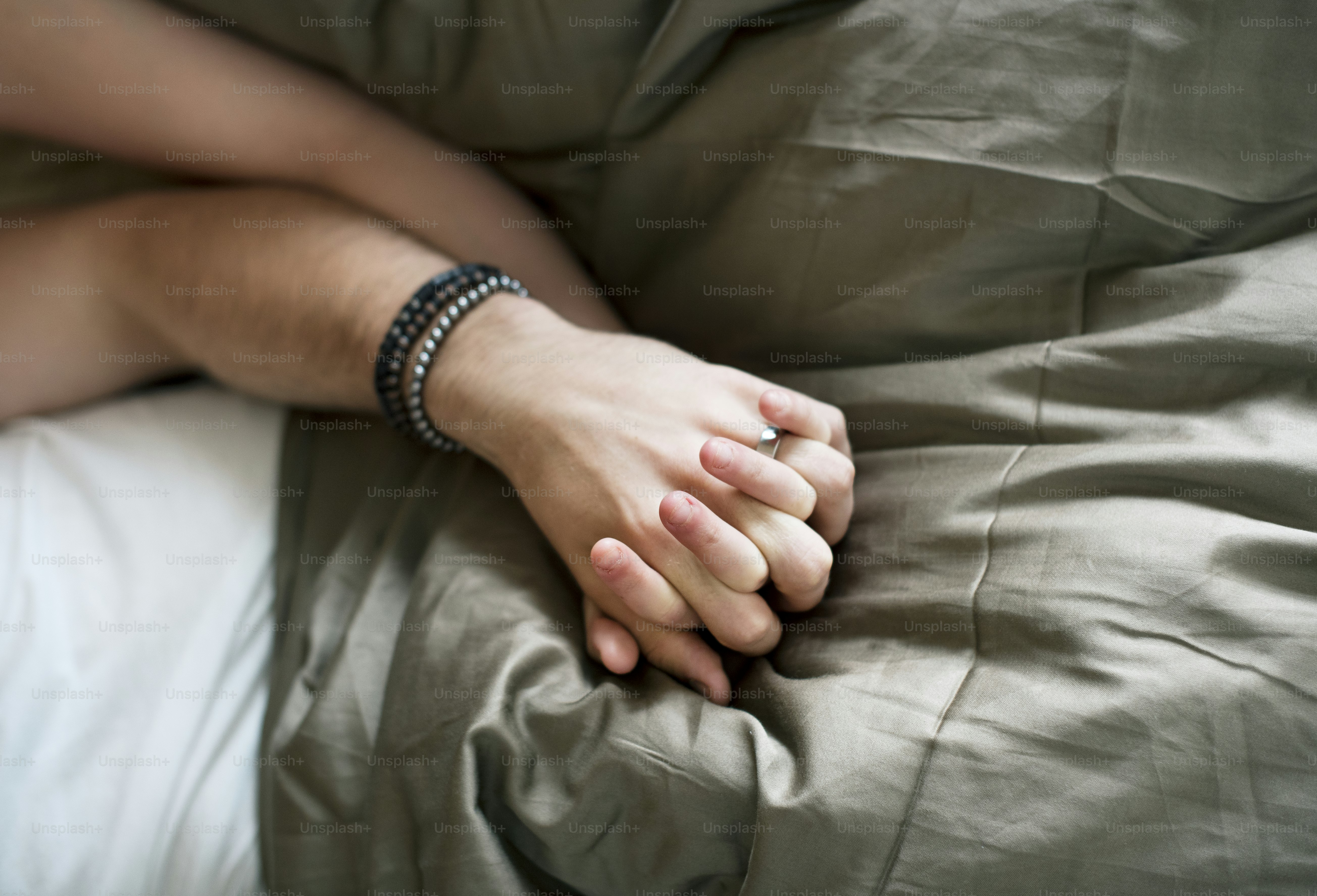 Caucasian couple lying on bed together