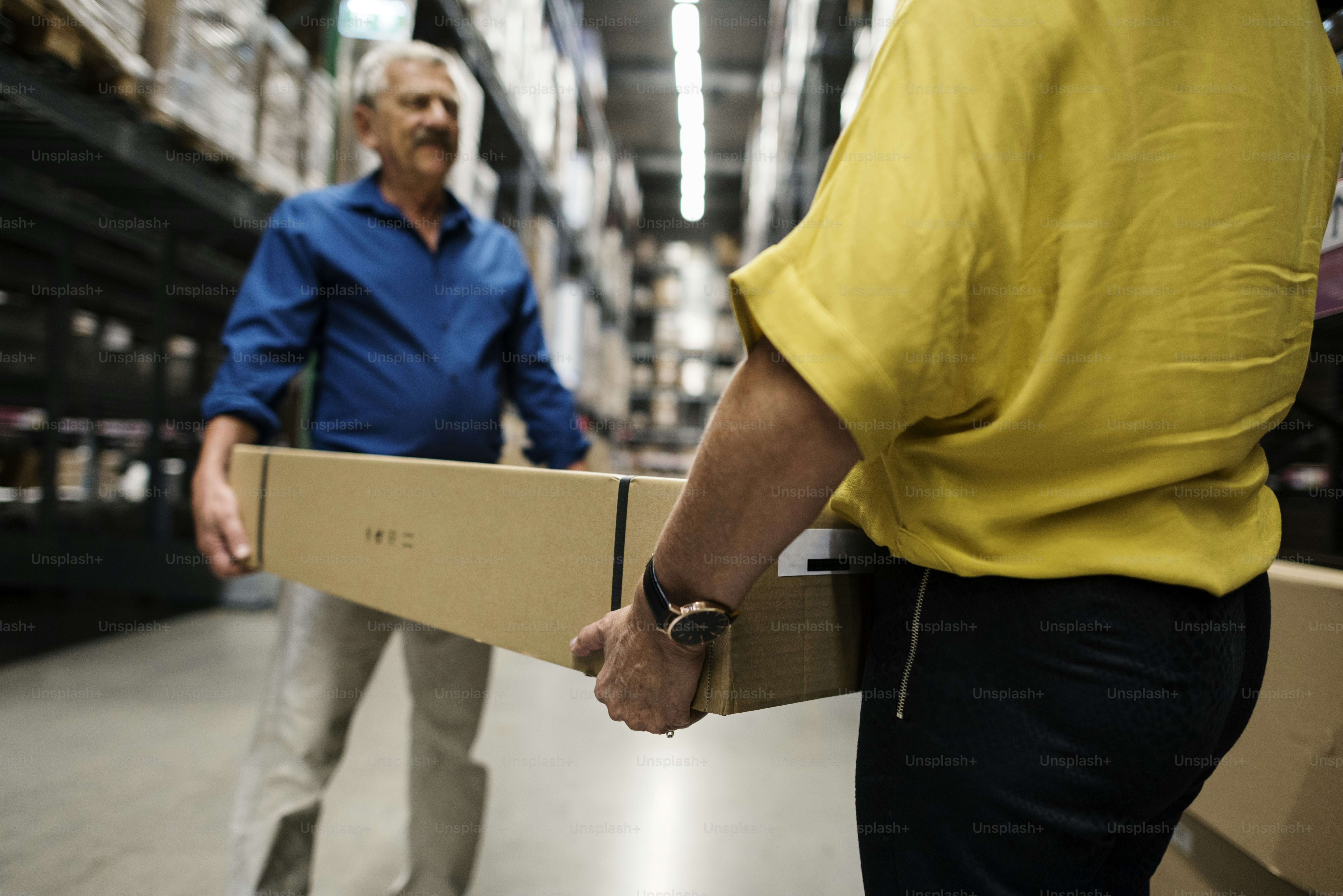 Caucasian couple is lifting thing from shelf