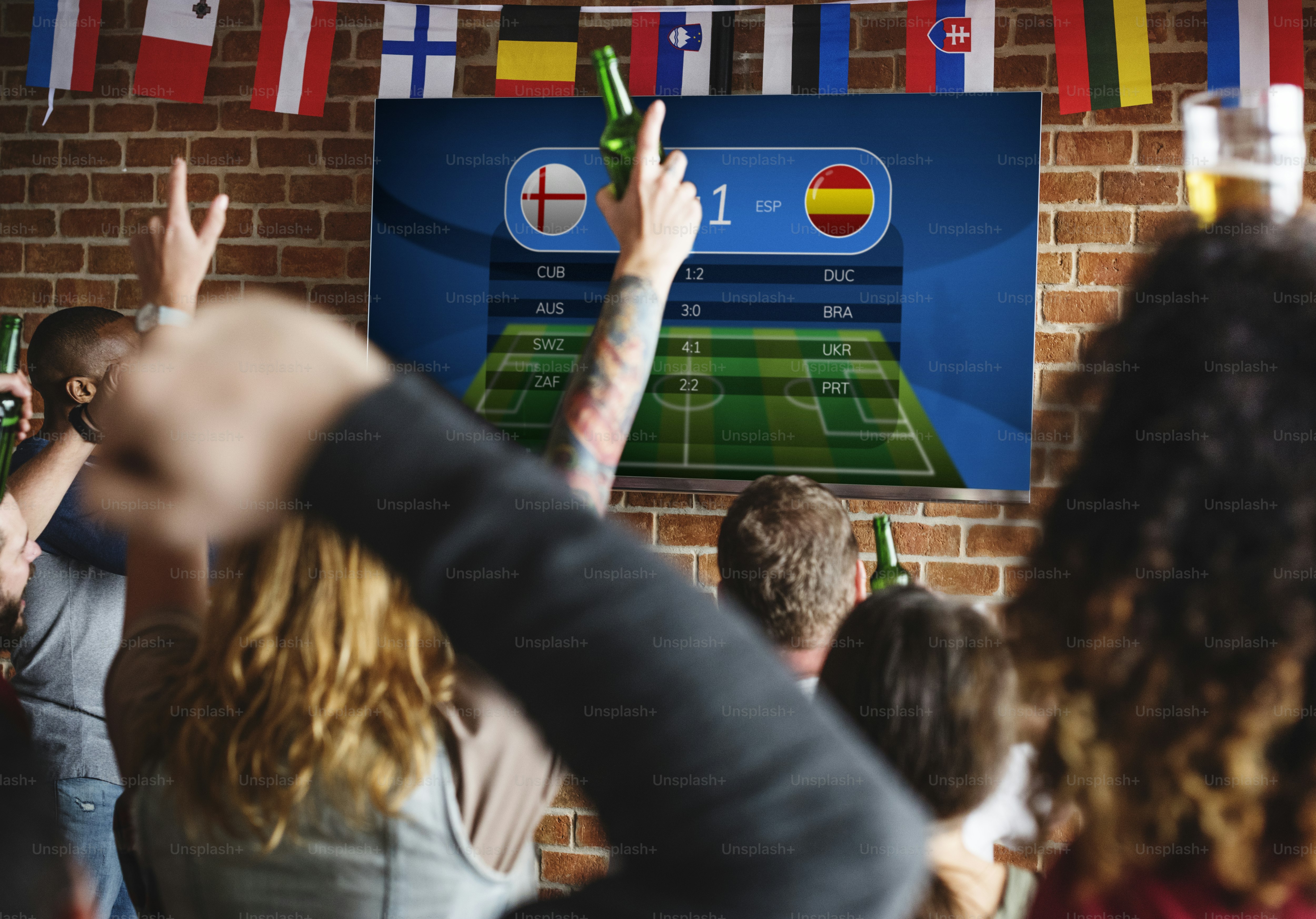Friends cheering sport at bar together