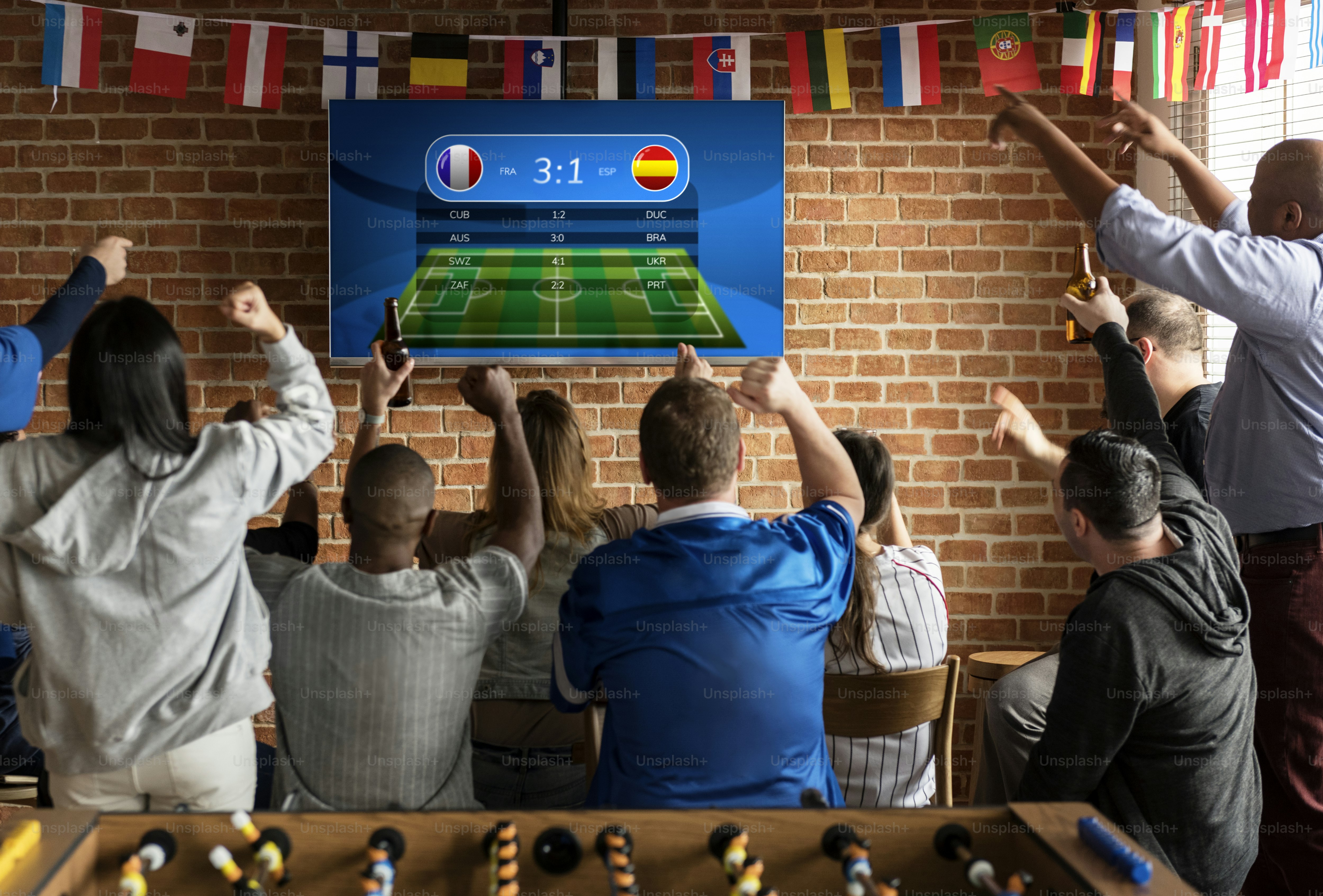 Friends cheering sport at bar together ***These graphics are derived from our own 3D generic designs. They do not infringe on any copyright design.