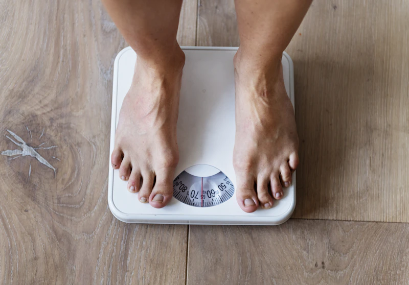 Bathroom scale on a tiled floor