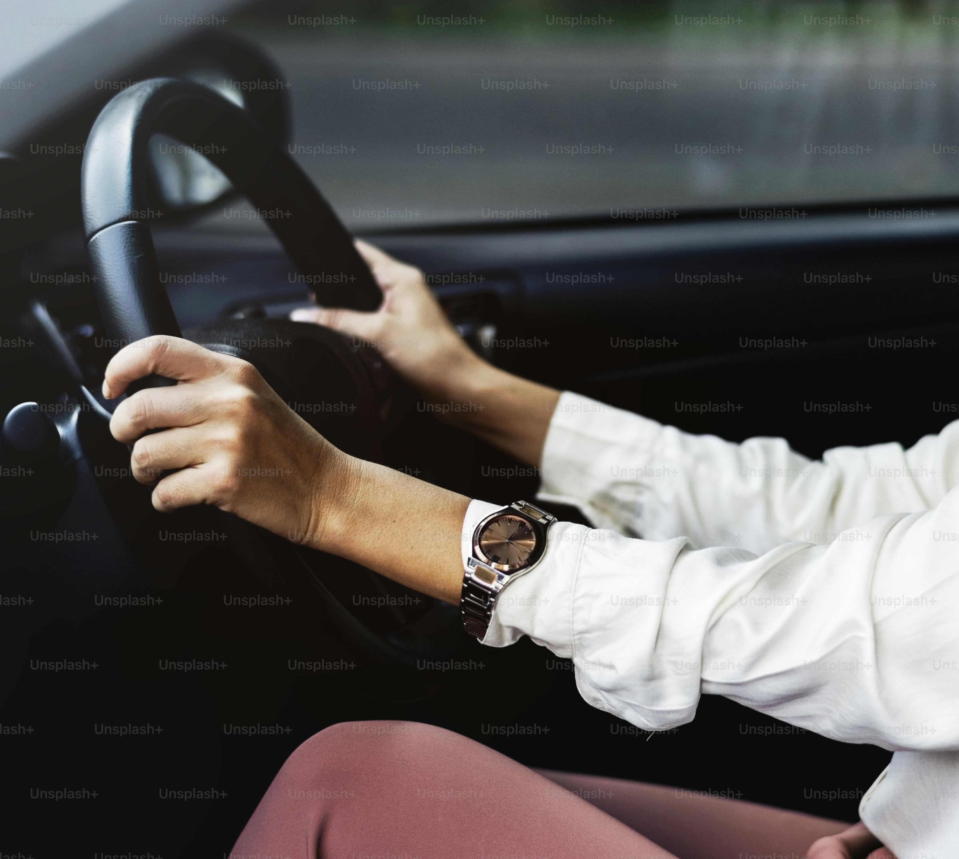 Woman driving a car on a road