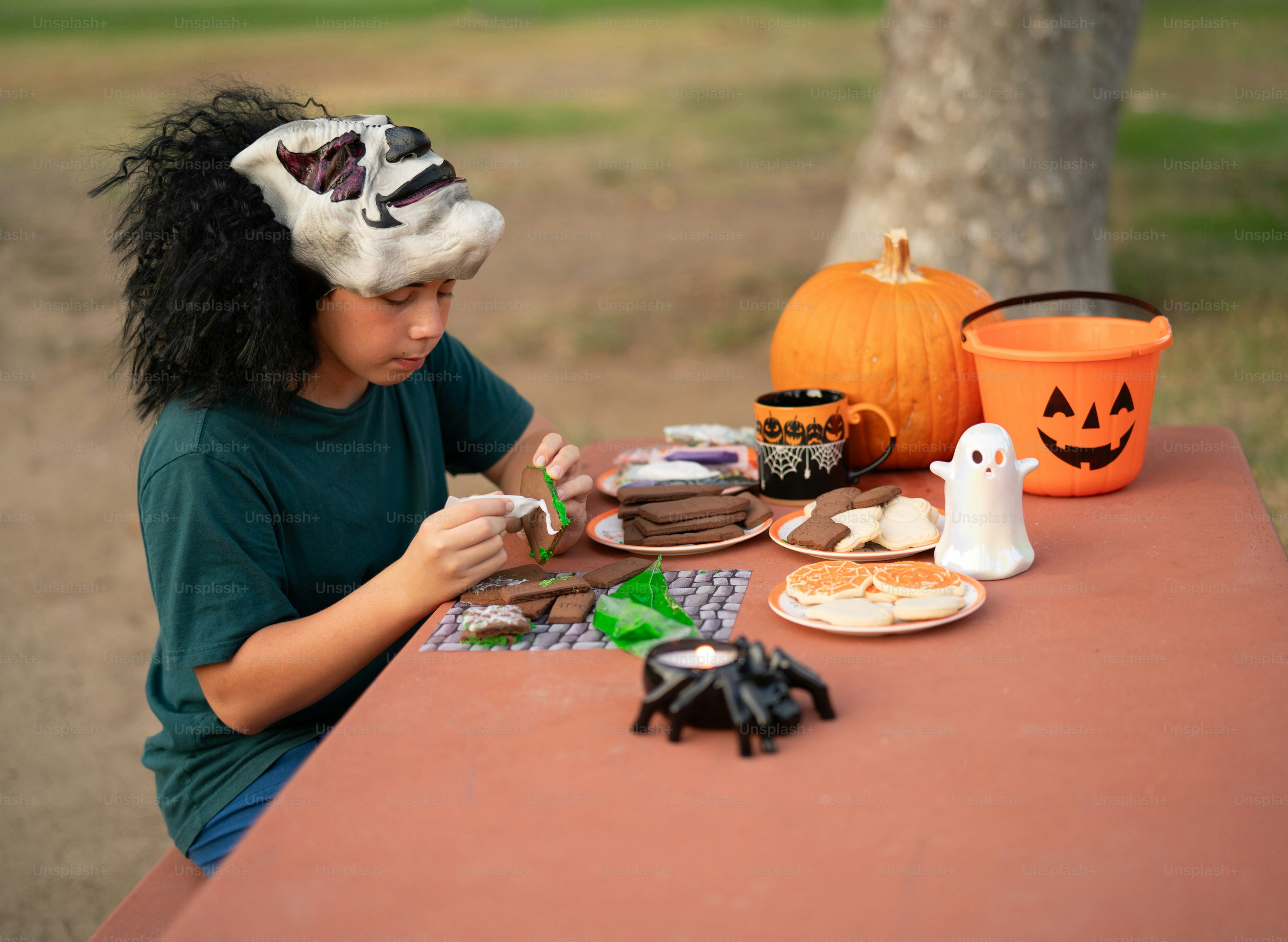A woman sitting at a table with a plate of food
