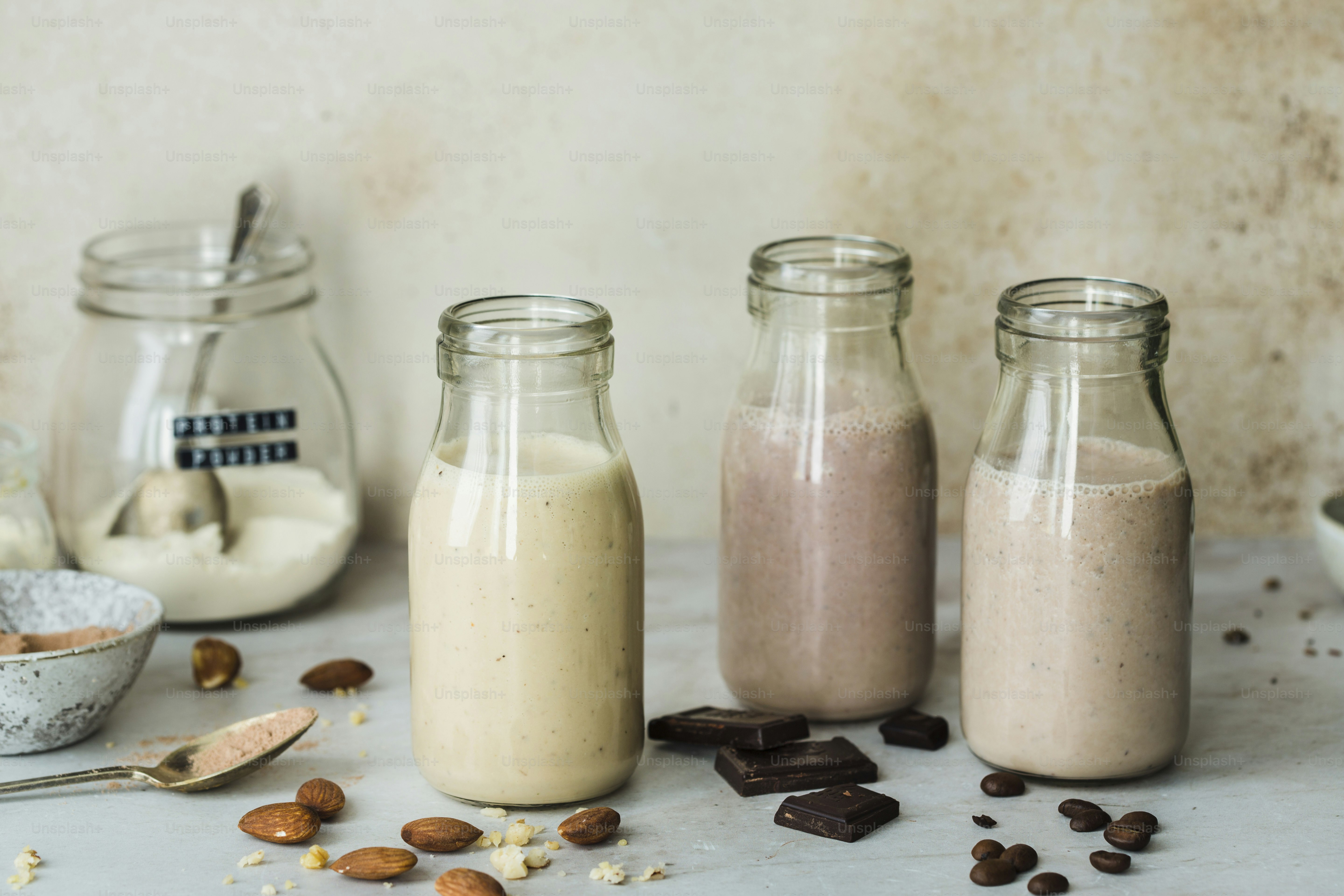 A table topped with jars filled with different types of food