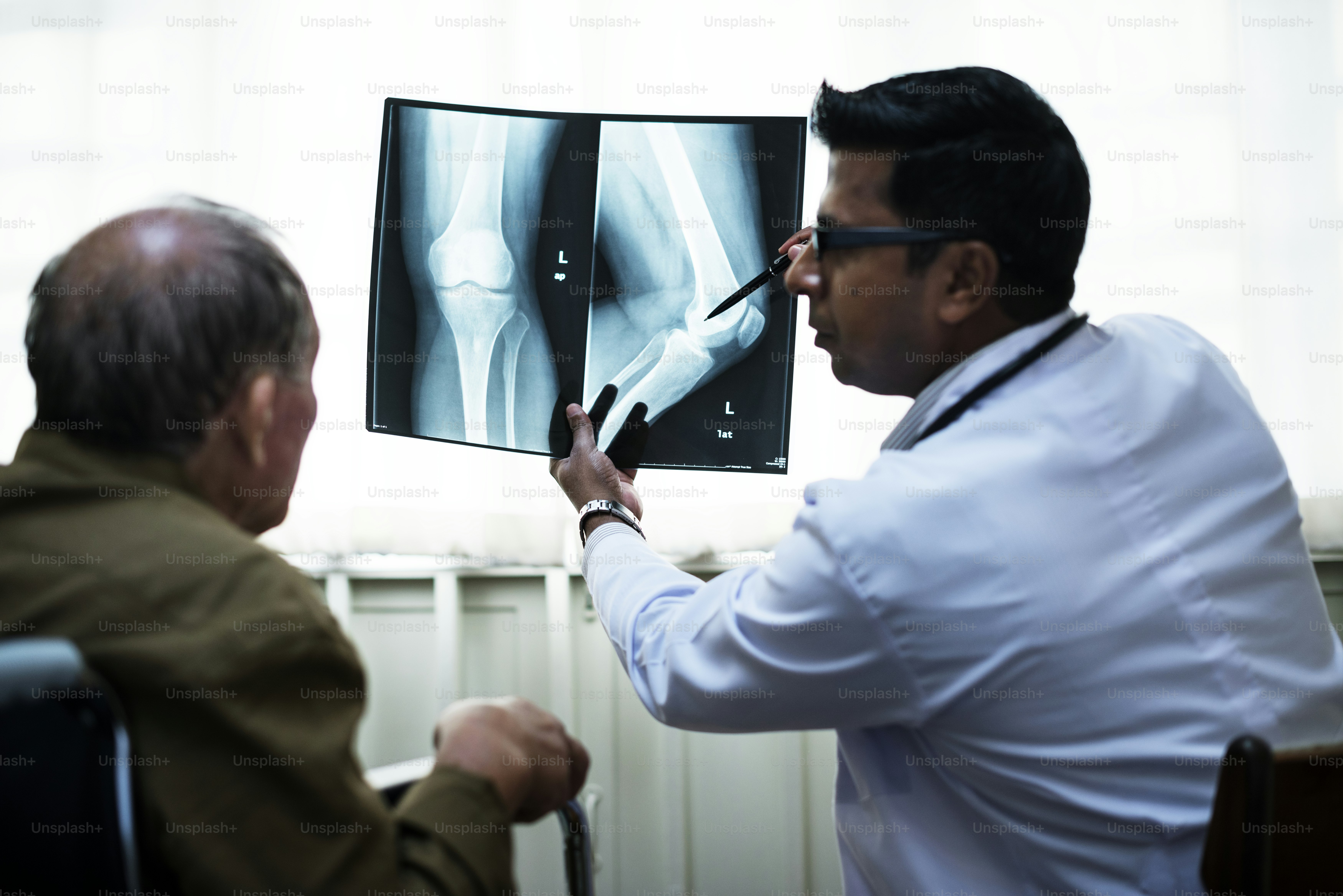 Doctor with a patient's x-ray film